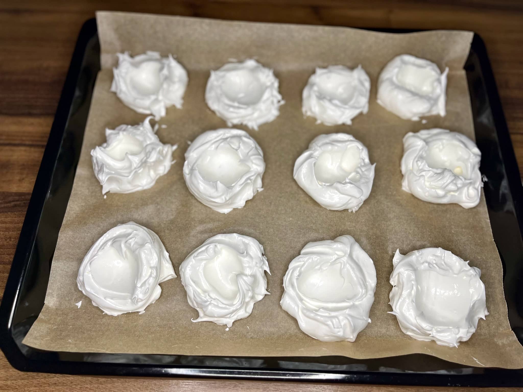 Meringue formed on baking trays before baking