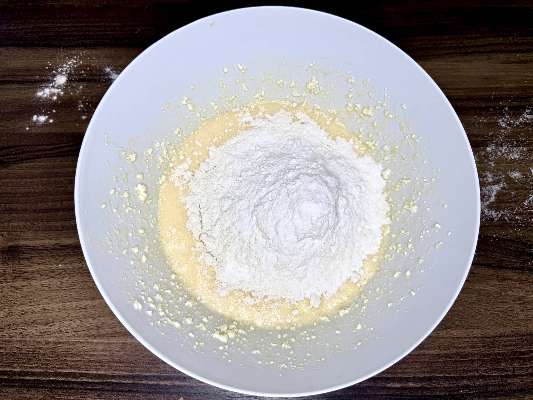 Flour added to the mixing bowl with the other ingredients