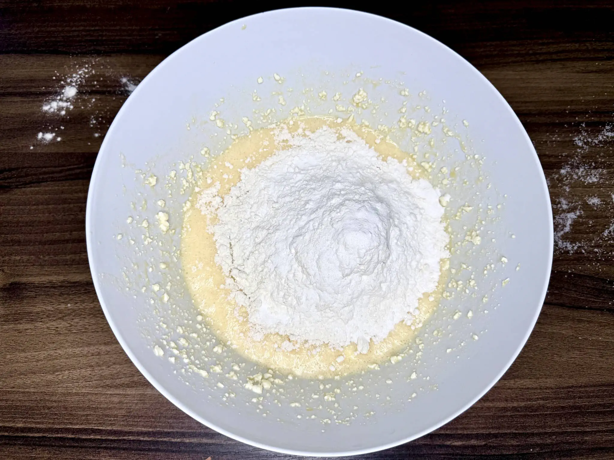 Flour added to the mixing bowl with the other ingredients