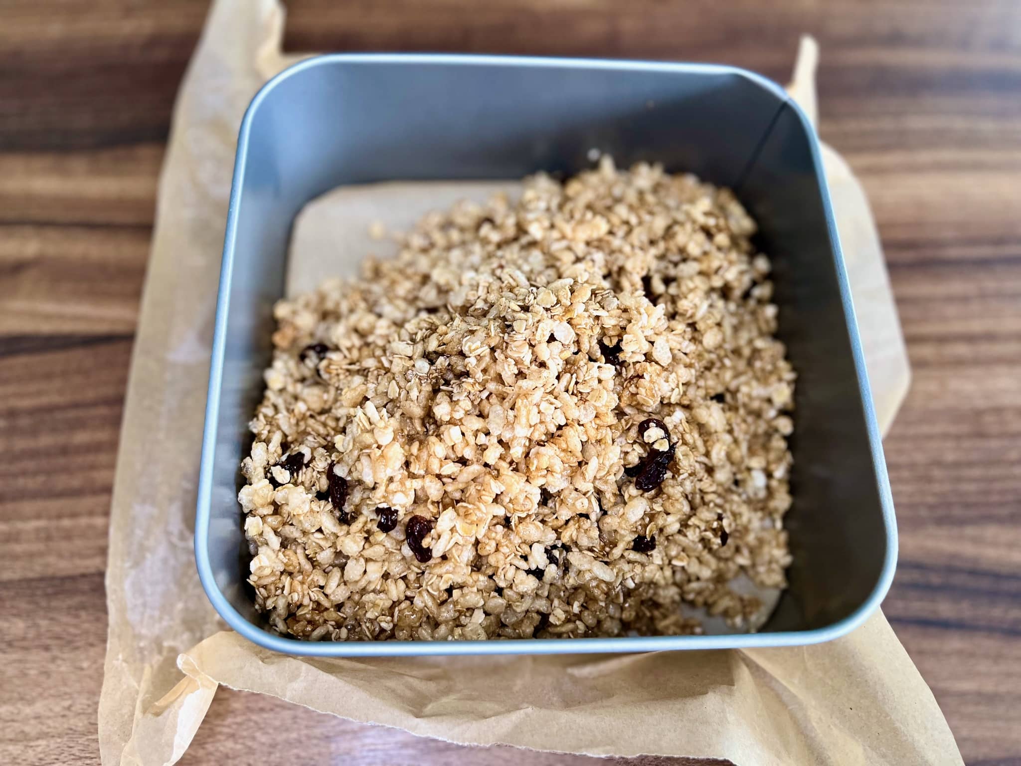Rice Krispies Bars mixture placed in a tin