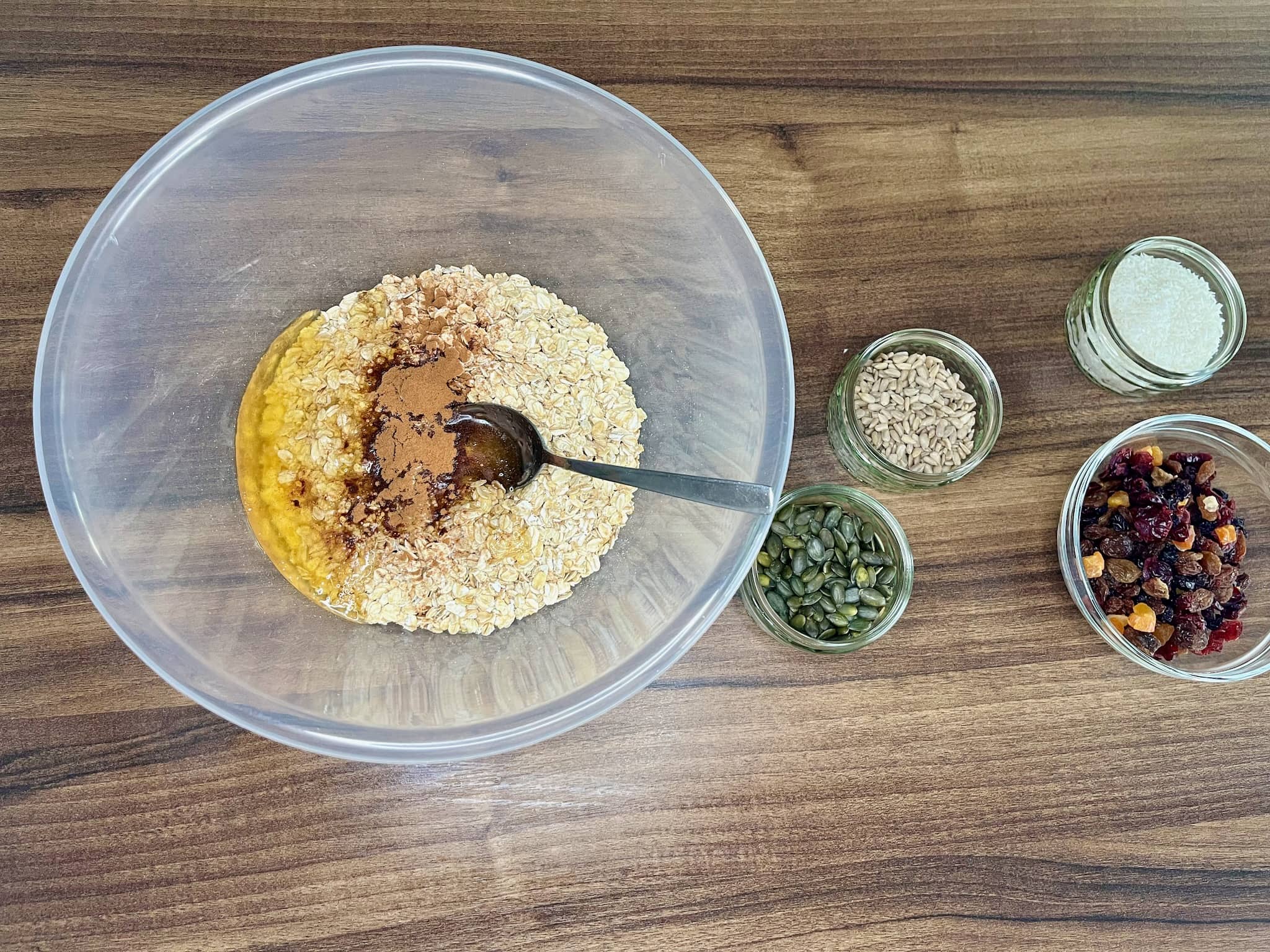 Honey, oil and cinnamon ground mixed with oats in a bowl