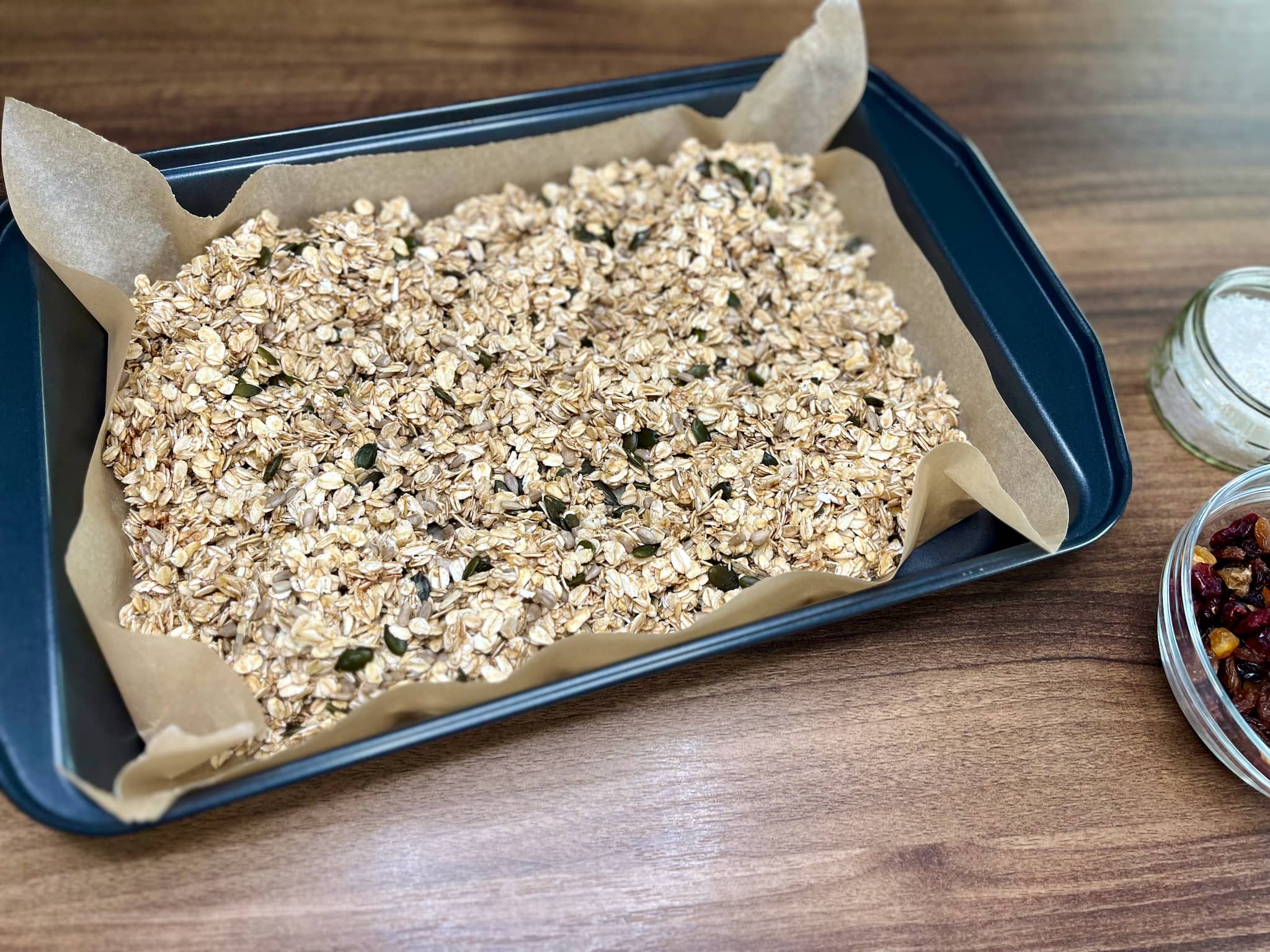 Oats-seeds mixture on a baking tray before baking in the oven