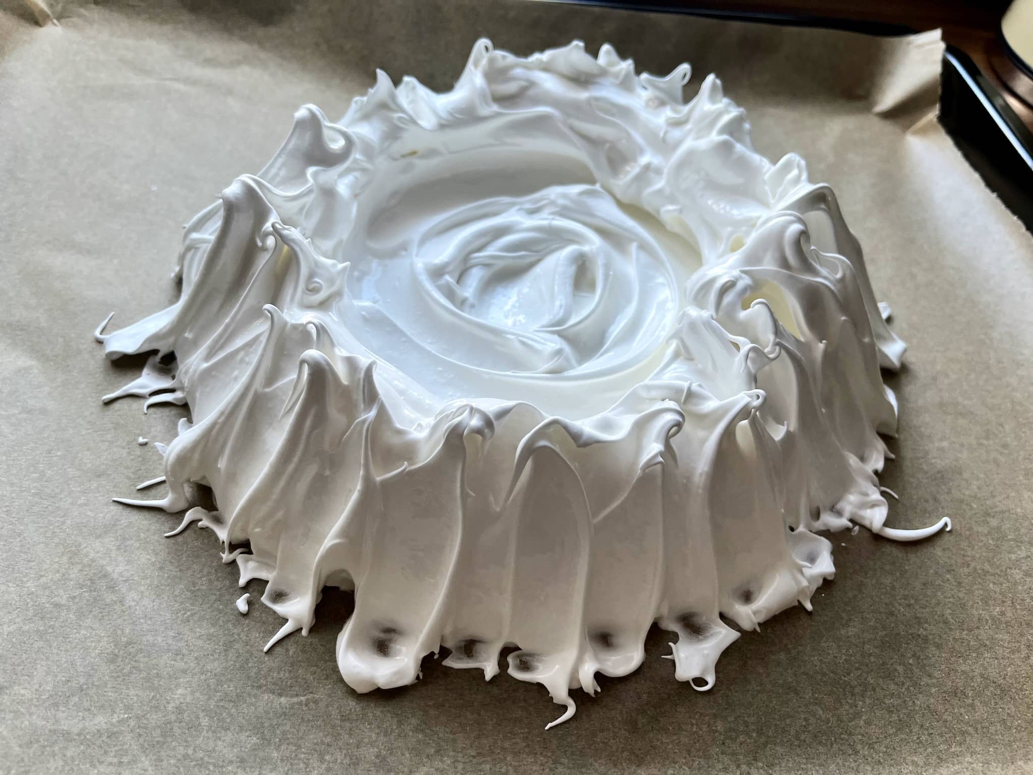 Meringue on a tray shaped in form of a nest