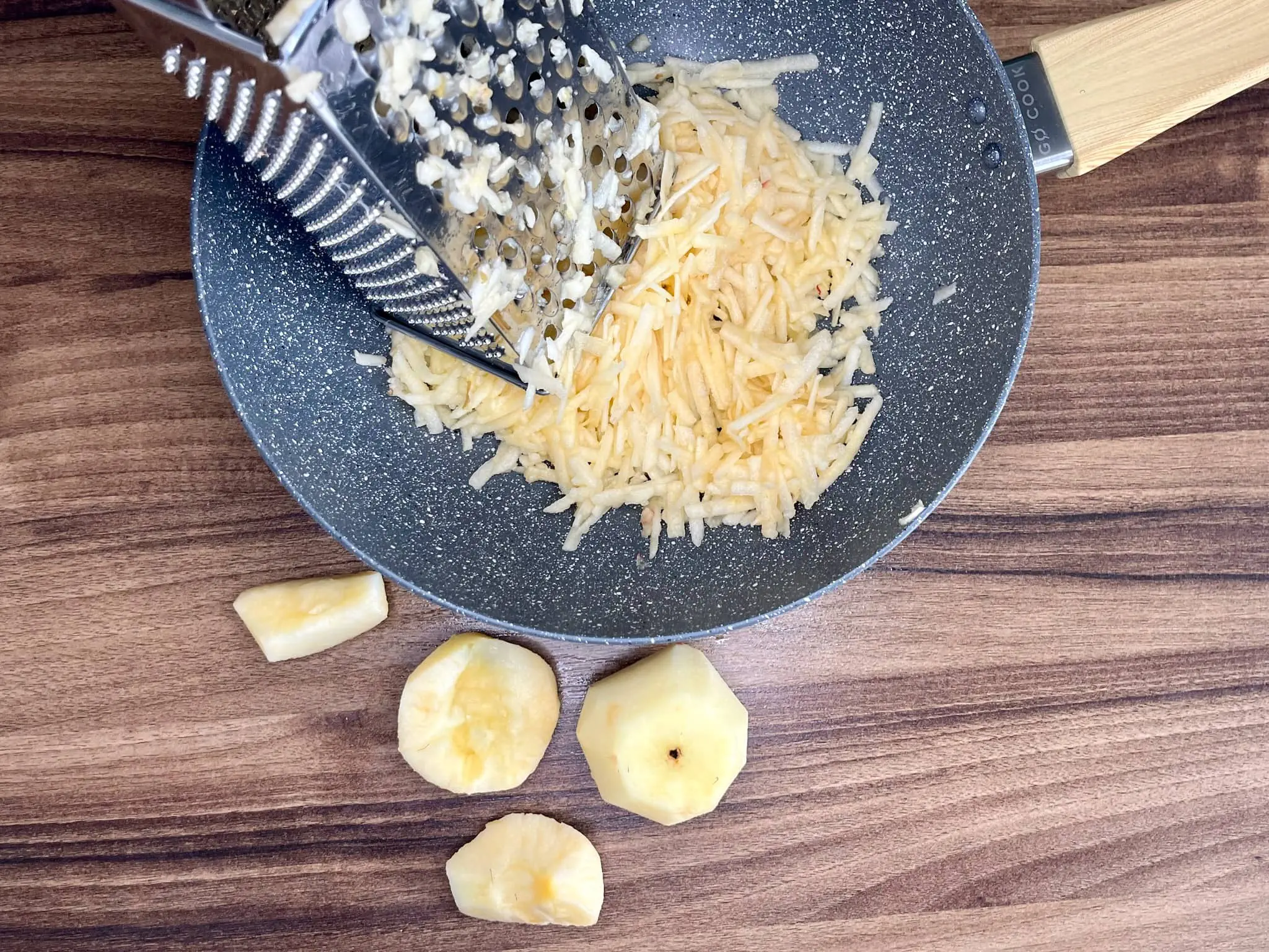 Grate the peeled apples on a medium grater over a large mixing bowl