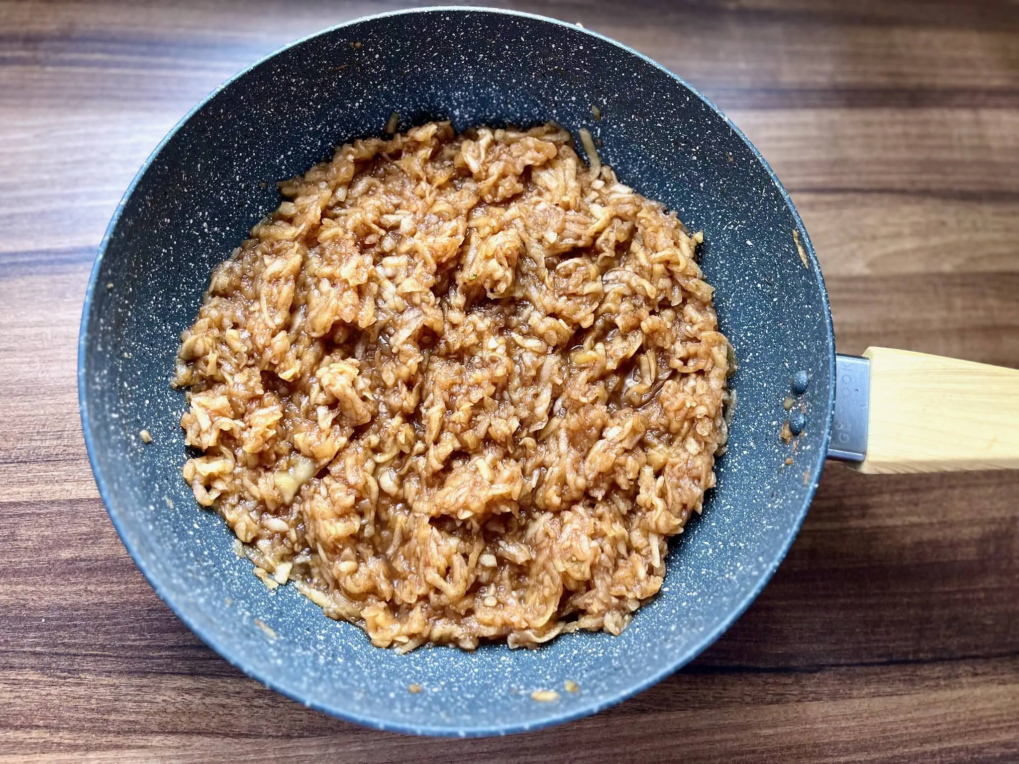 Cooked grated apples in a pan