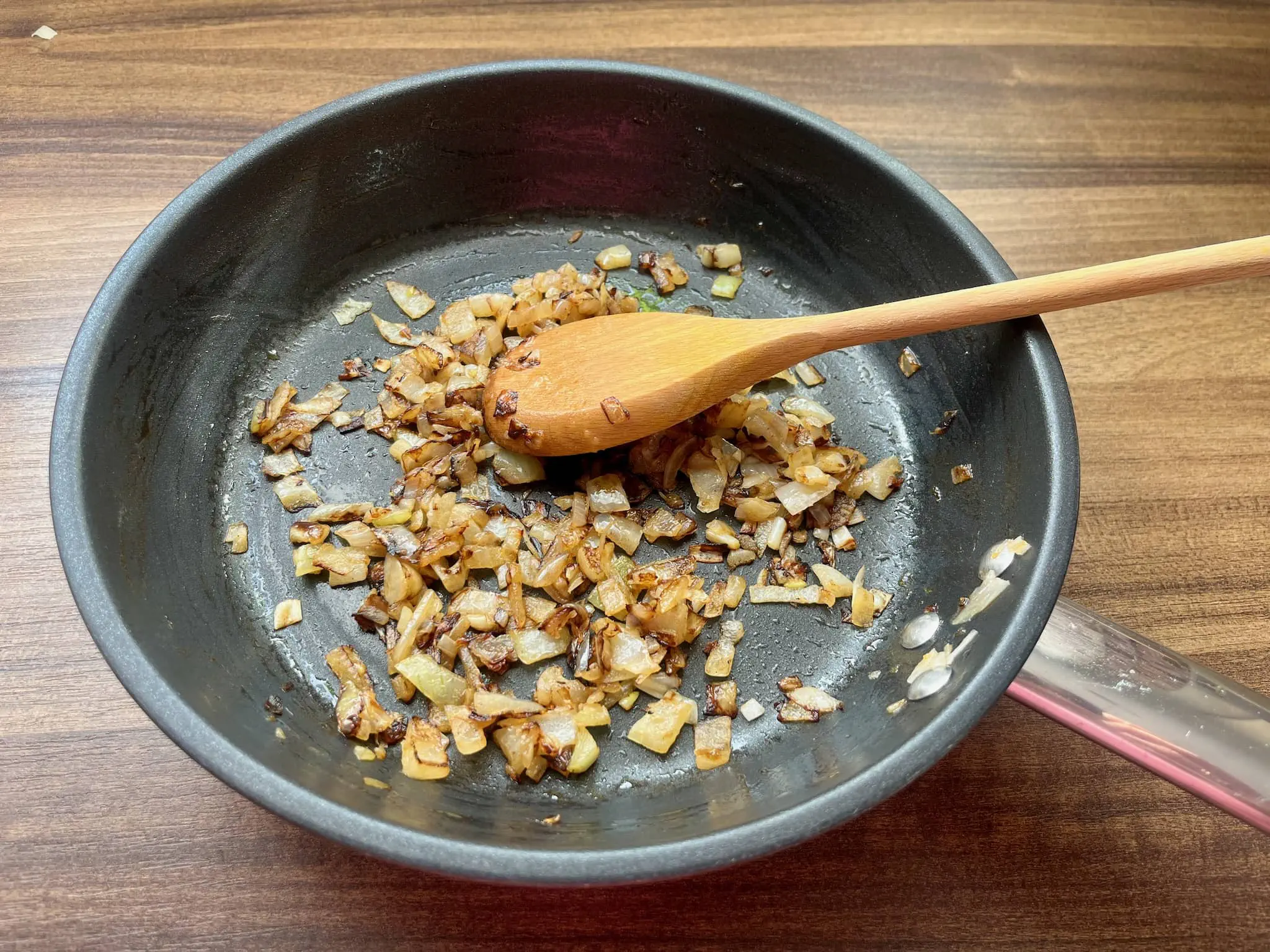 Onion browning in a pan