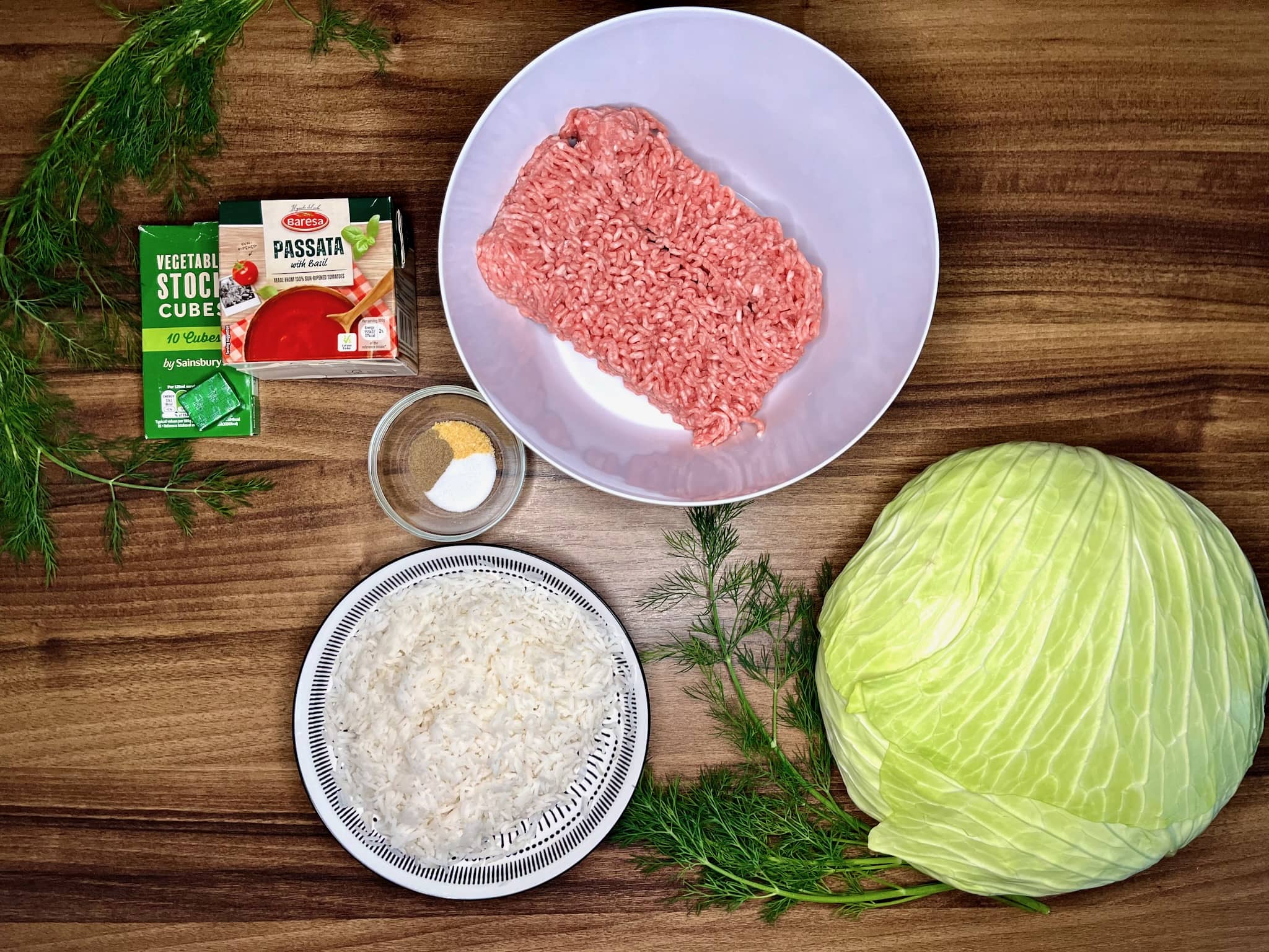 All the ingredients on tabletop readyto make Polish Stuffed Cabbage Rolls (Gołąbki)