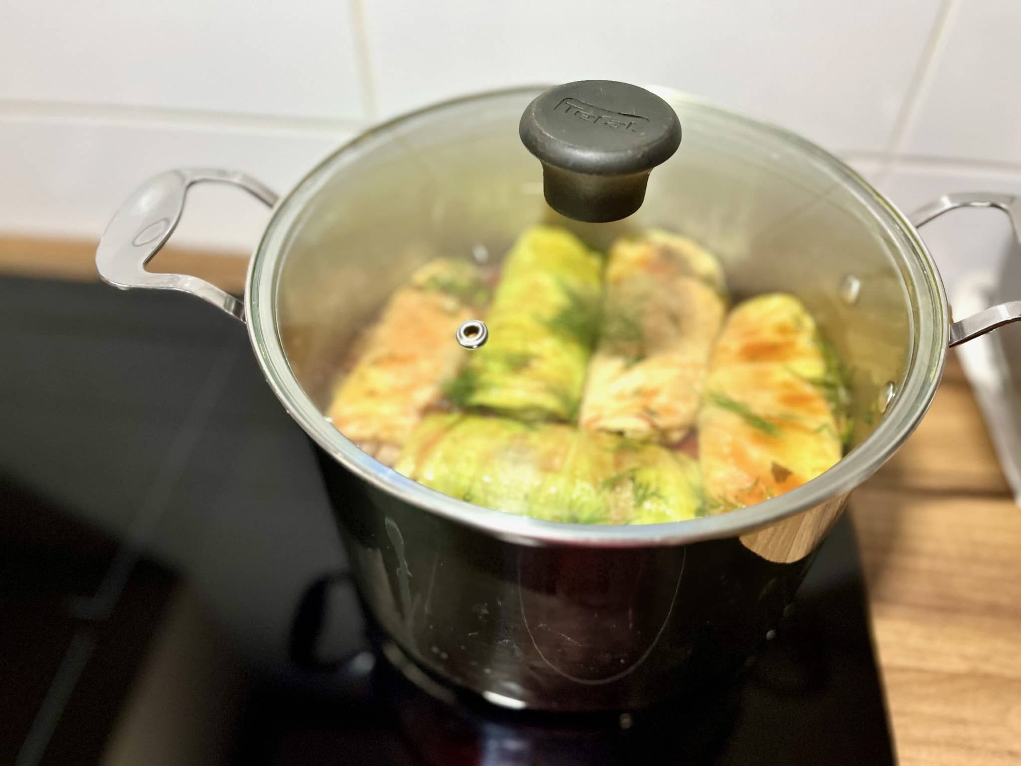 Cooking Stuffed Cabbage Rolls in a pan