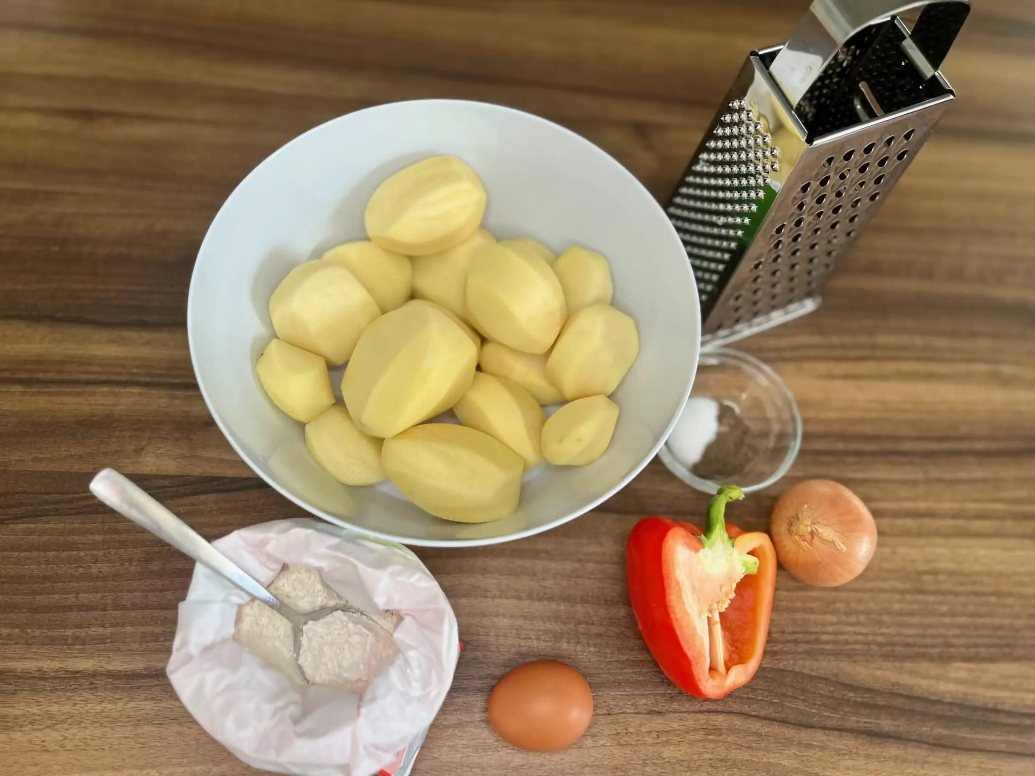 The ingredients for potato pancakes are all on the table, ready to be used