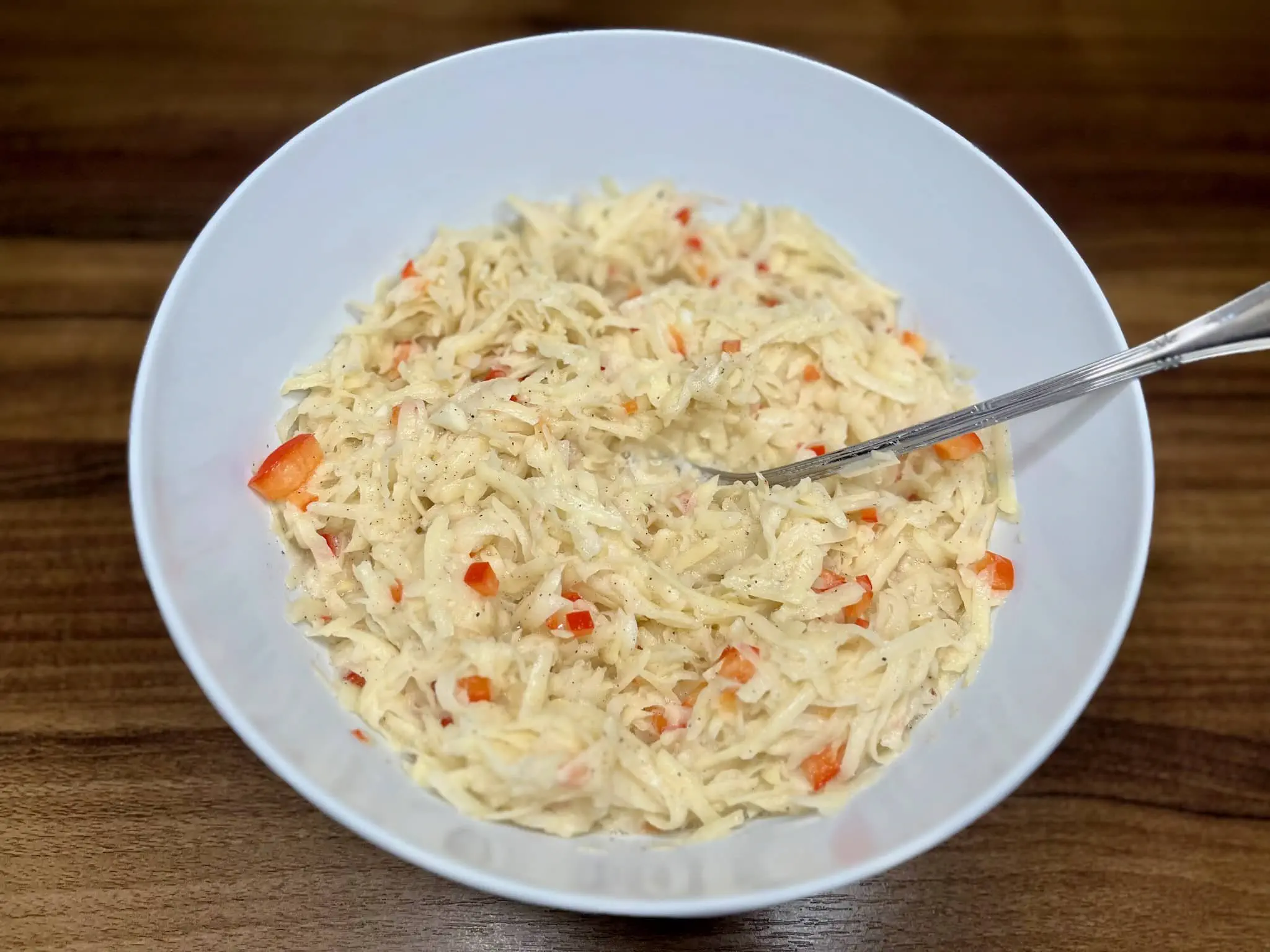 Mix the ready-made potato pancake mix in a bowl before frying