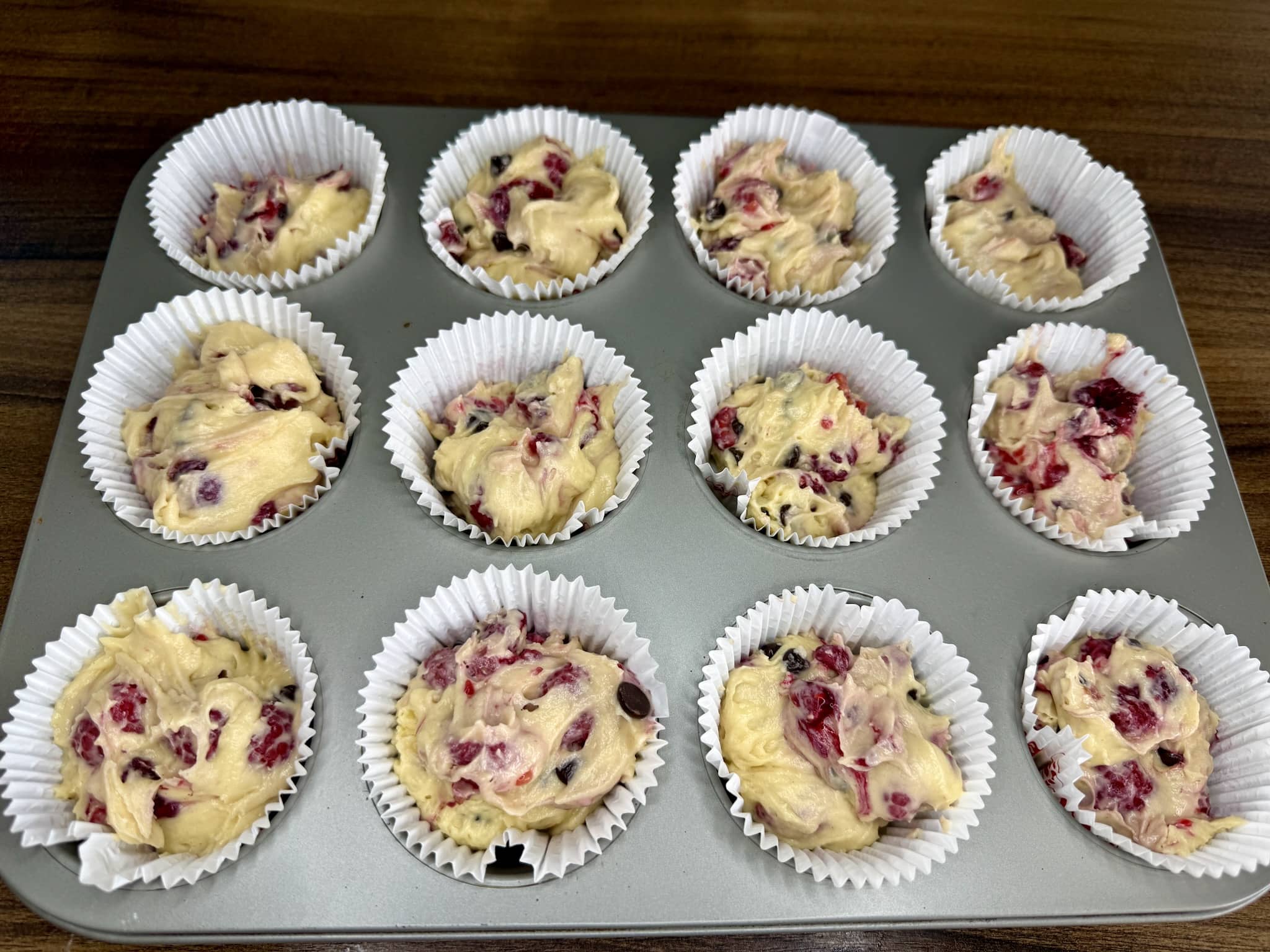 Muffins batter in muffin cases ready for baking