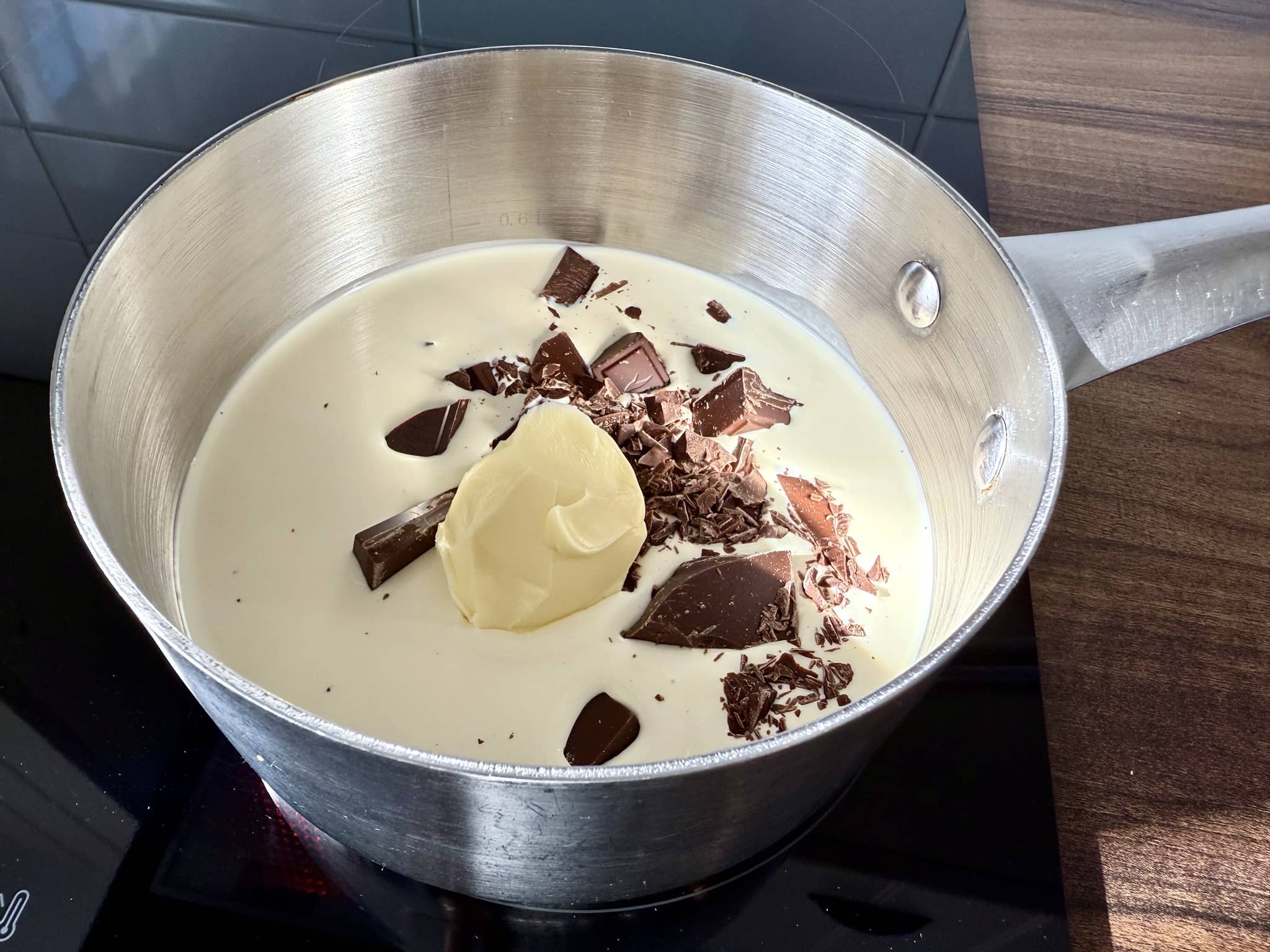 Double cream, butter, and chocolate in a medium pot on the stove