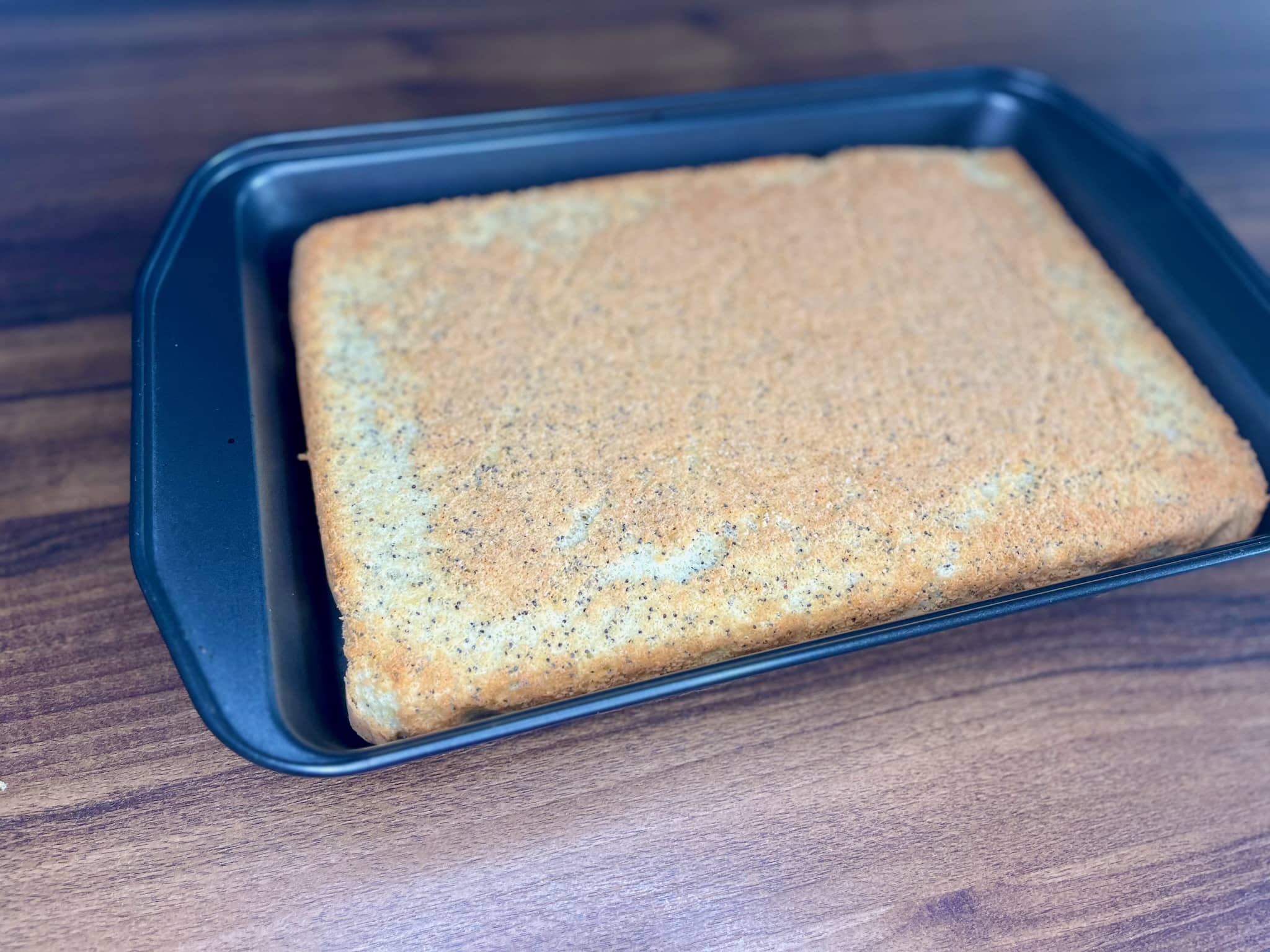 Baked cake upside down in a tin without baking paper