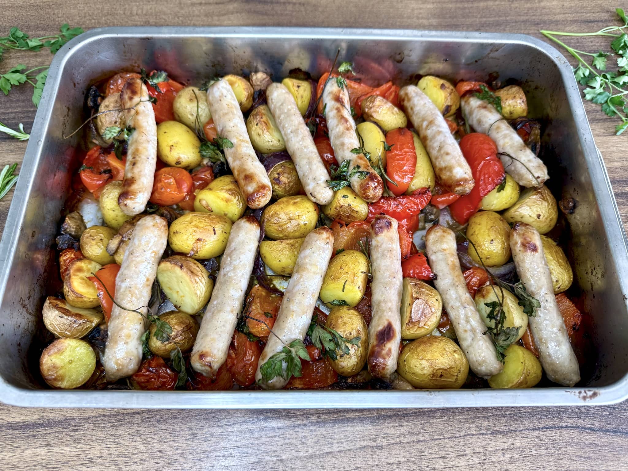 Perfectly roasted sausages and vegetables fresh from the oven