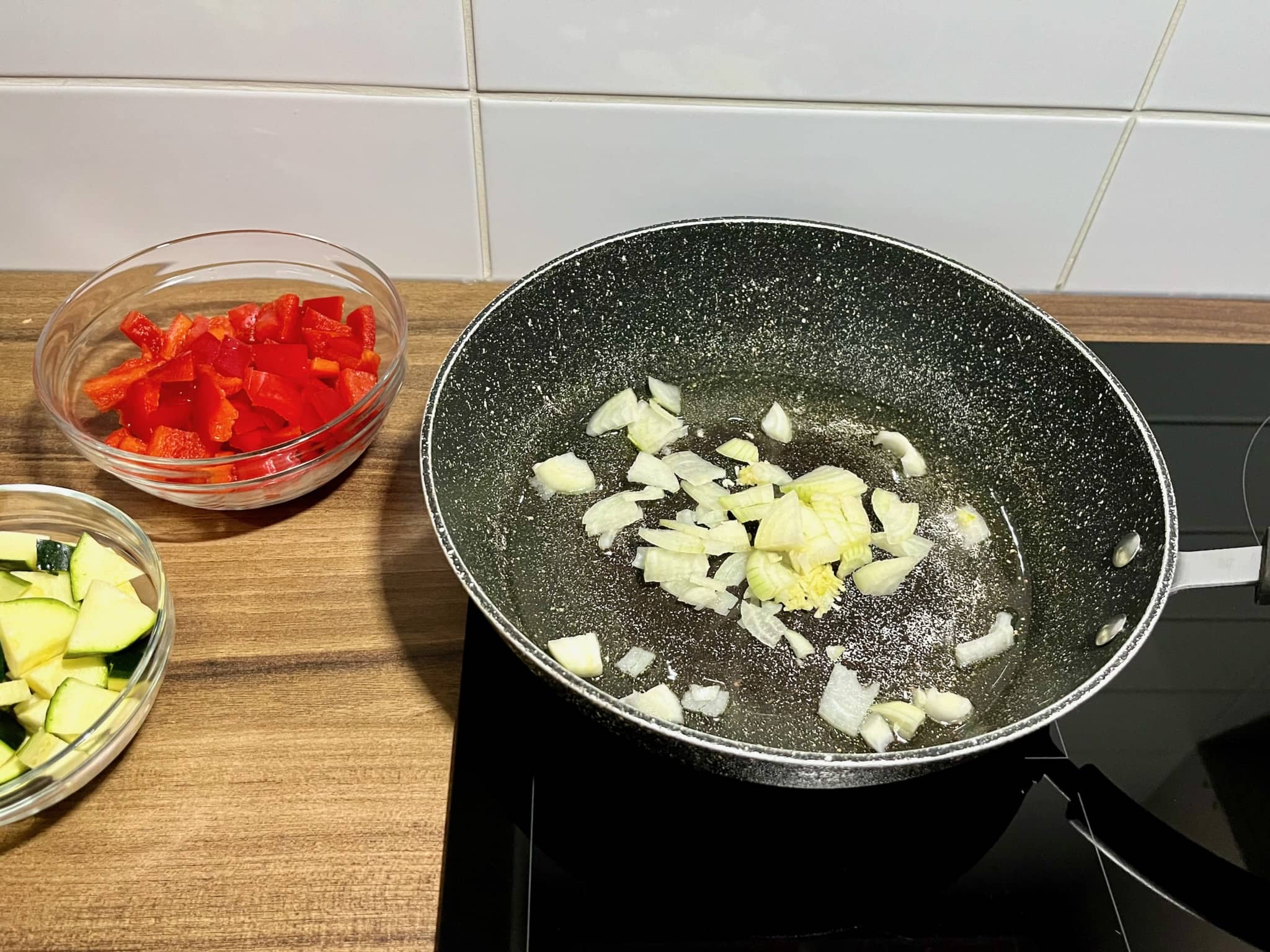 Onions and garlic frying in a pan