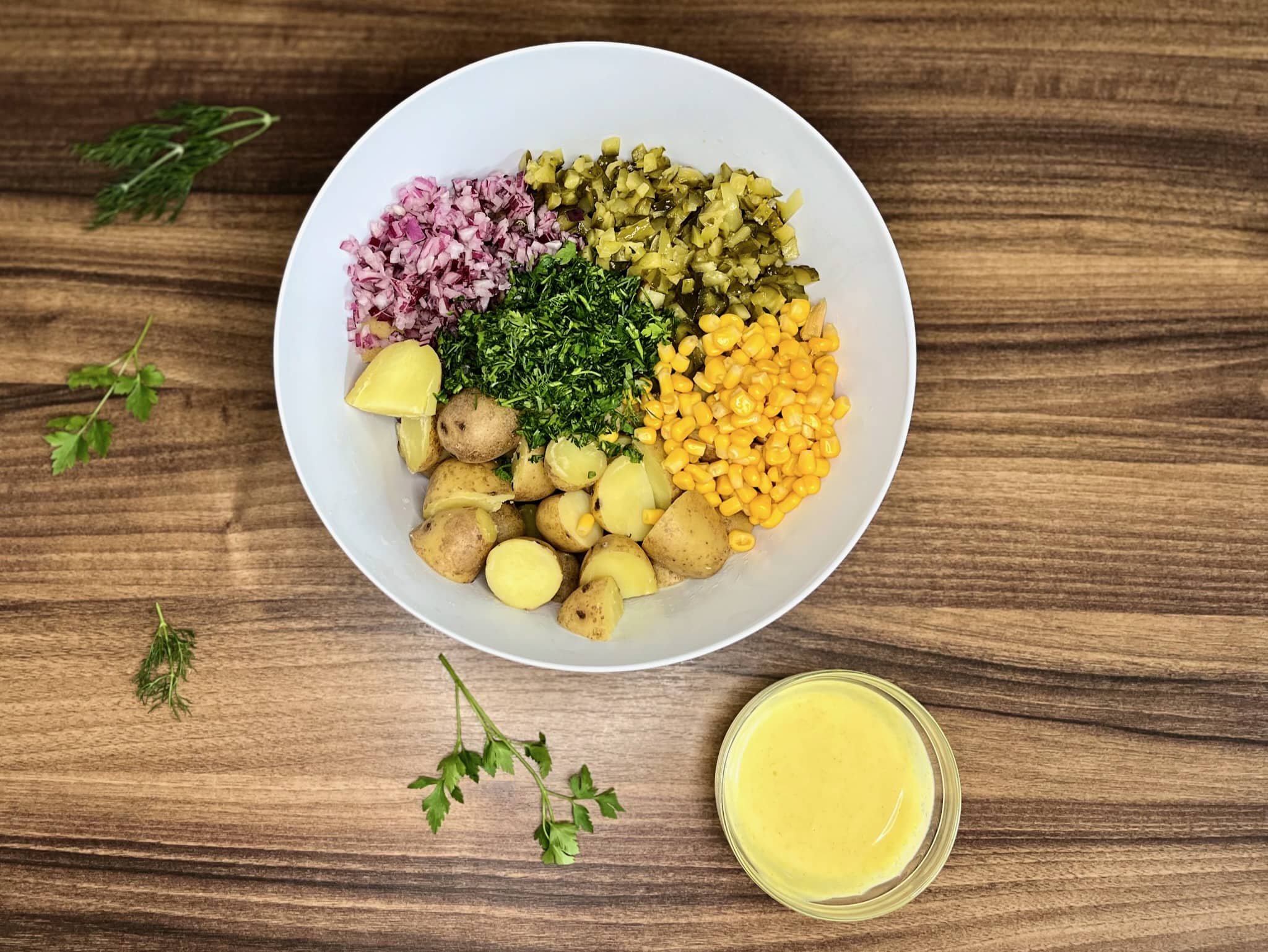 Prepped ingredients for Simple Baby Potato Salad in a mixing bowl