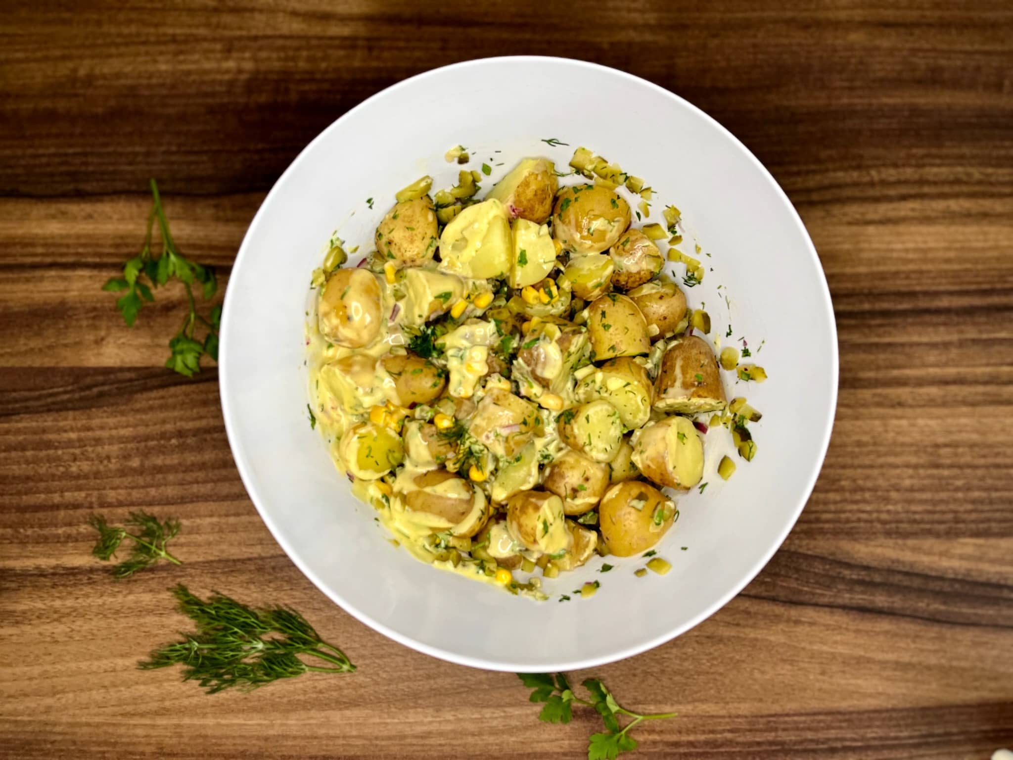 Ingredients for Simple Baby Potato Salad tossed and coated in dressing