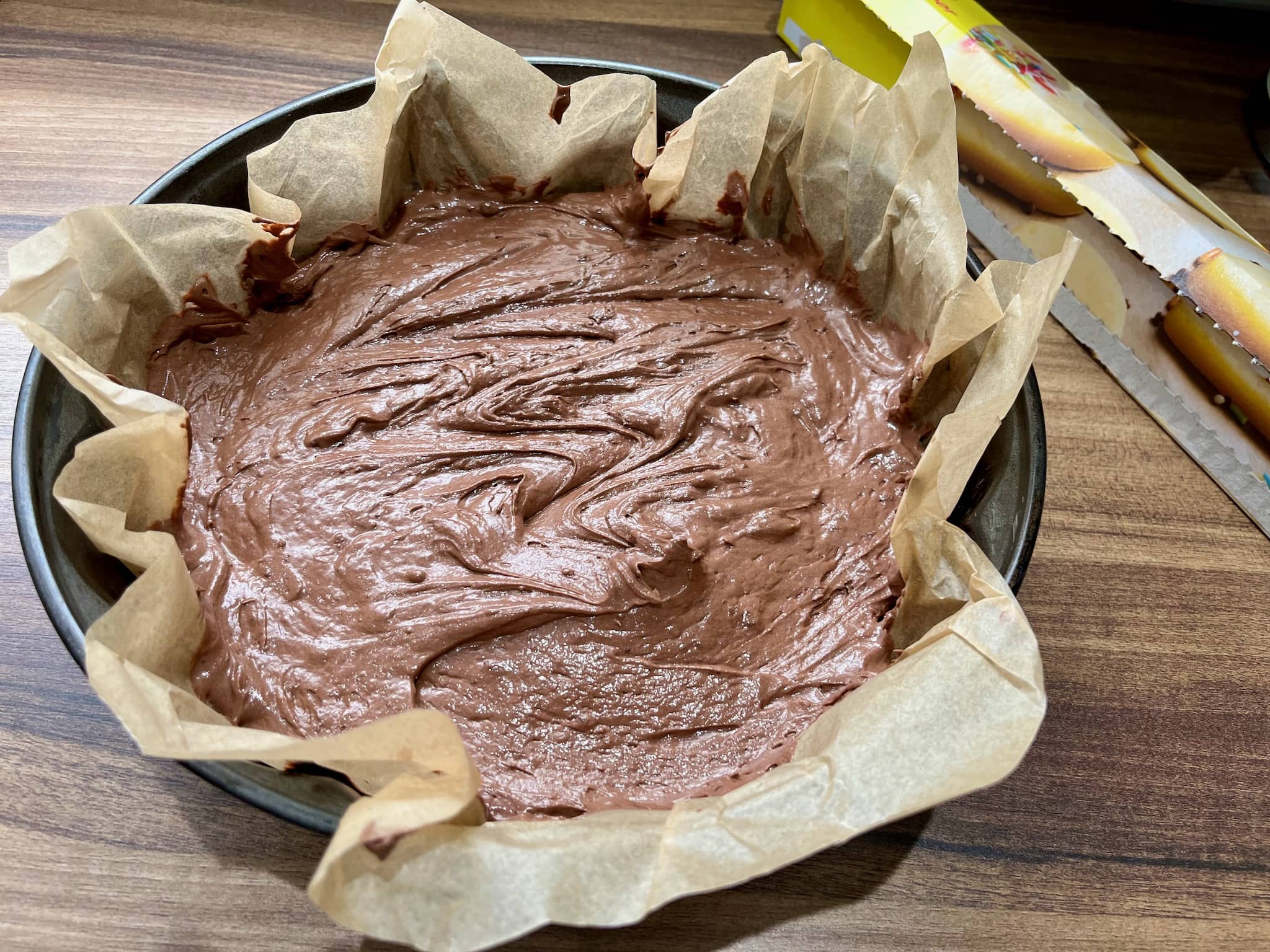 Chocolate cake mixture in a baking tray