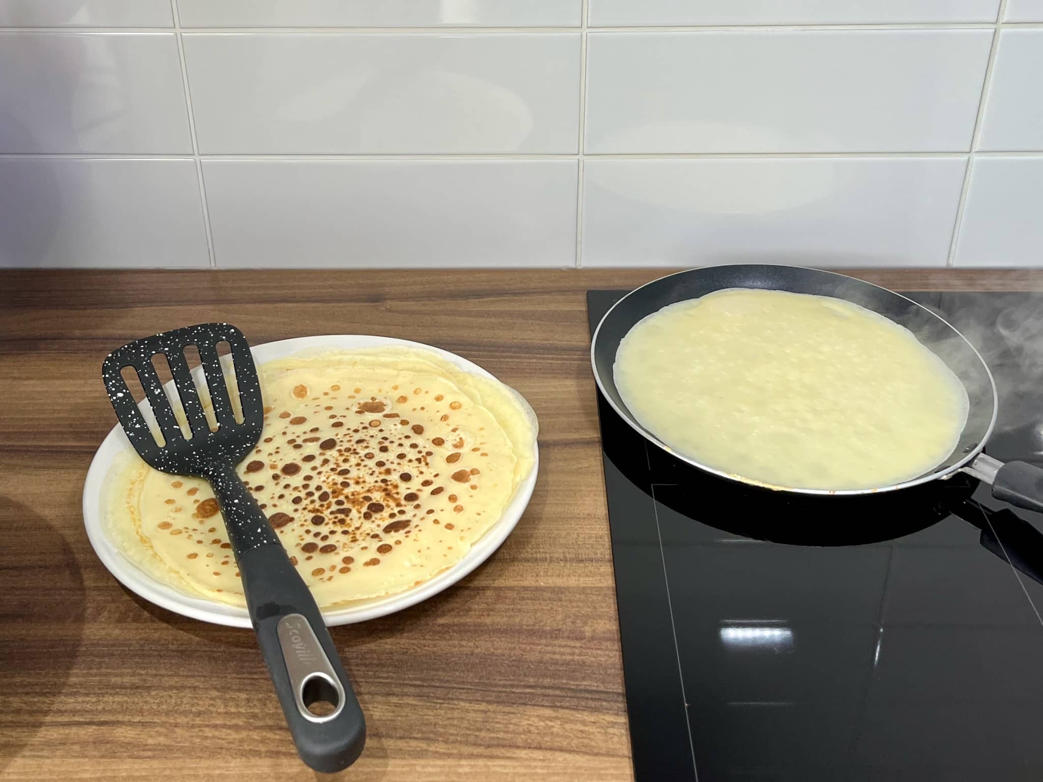Crêpes frying on the pan