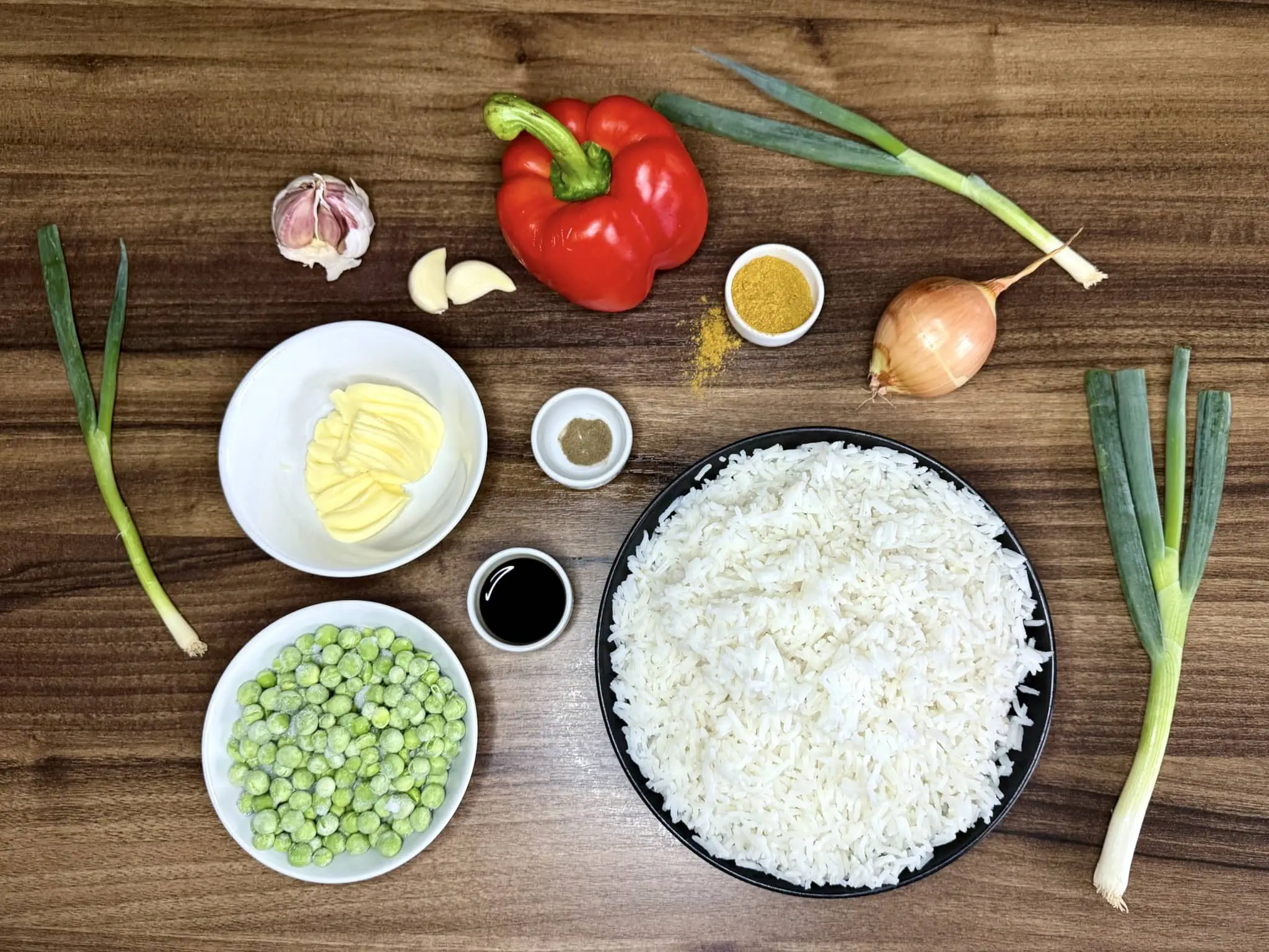 All the ingredients on the table top ready to make Simple Curry Fried Rice