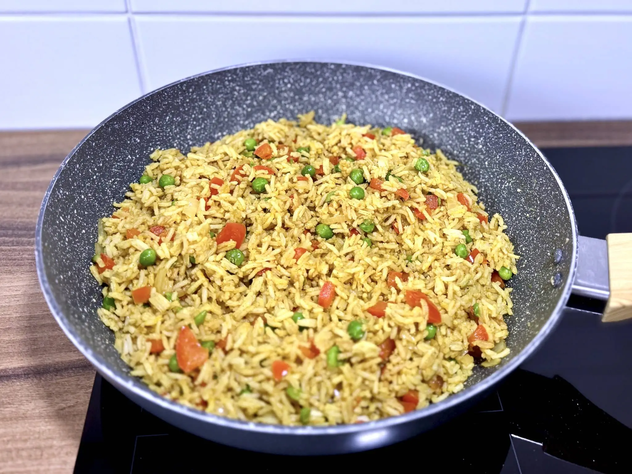 Rice mixed with vegetables in a pan