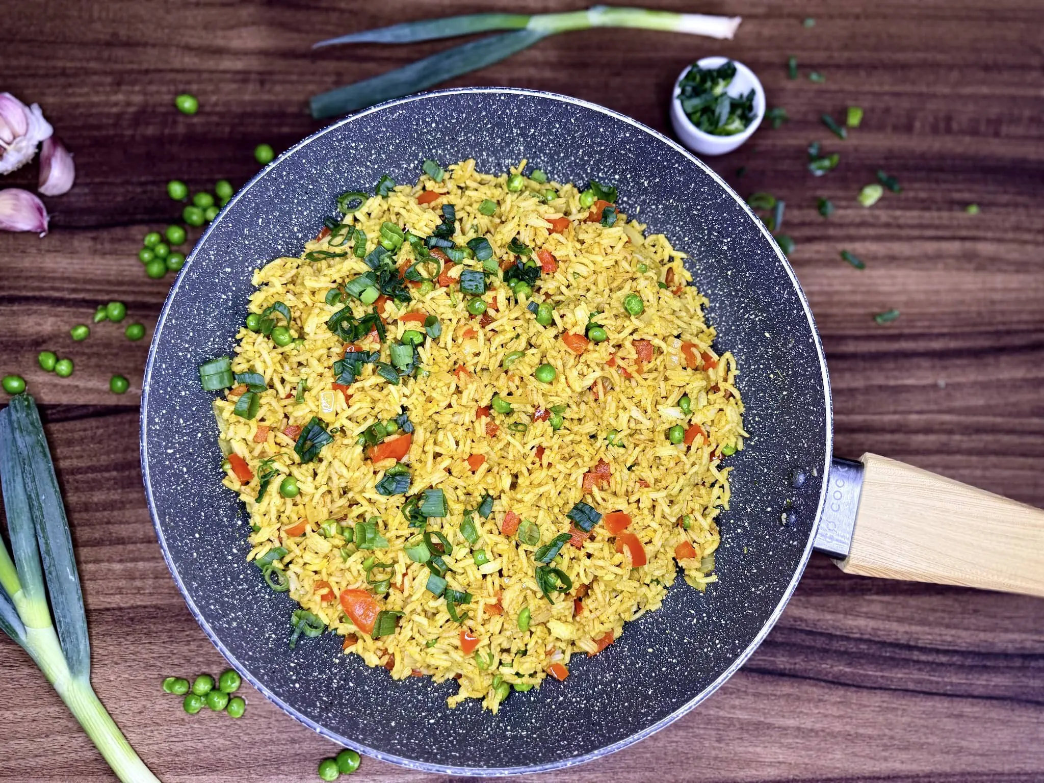 Ready-made Simple Curry Fried Rice in a pan sprinkled with spring onion on top