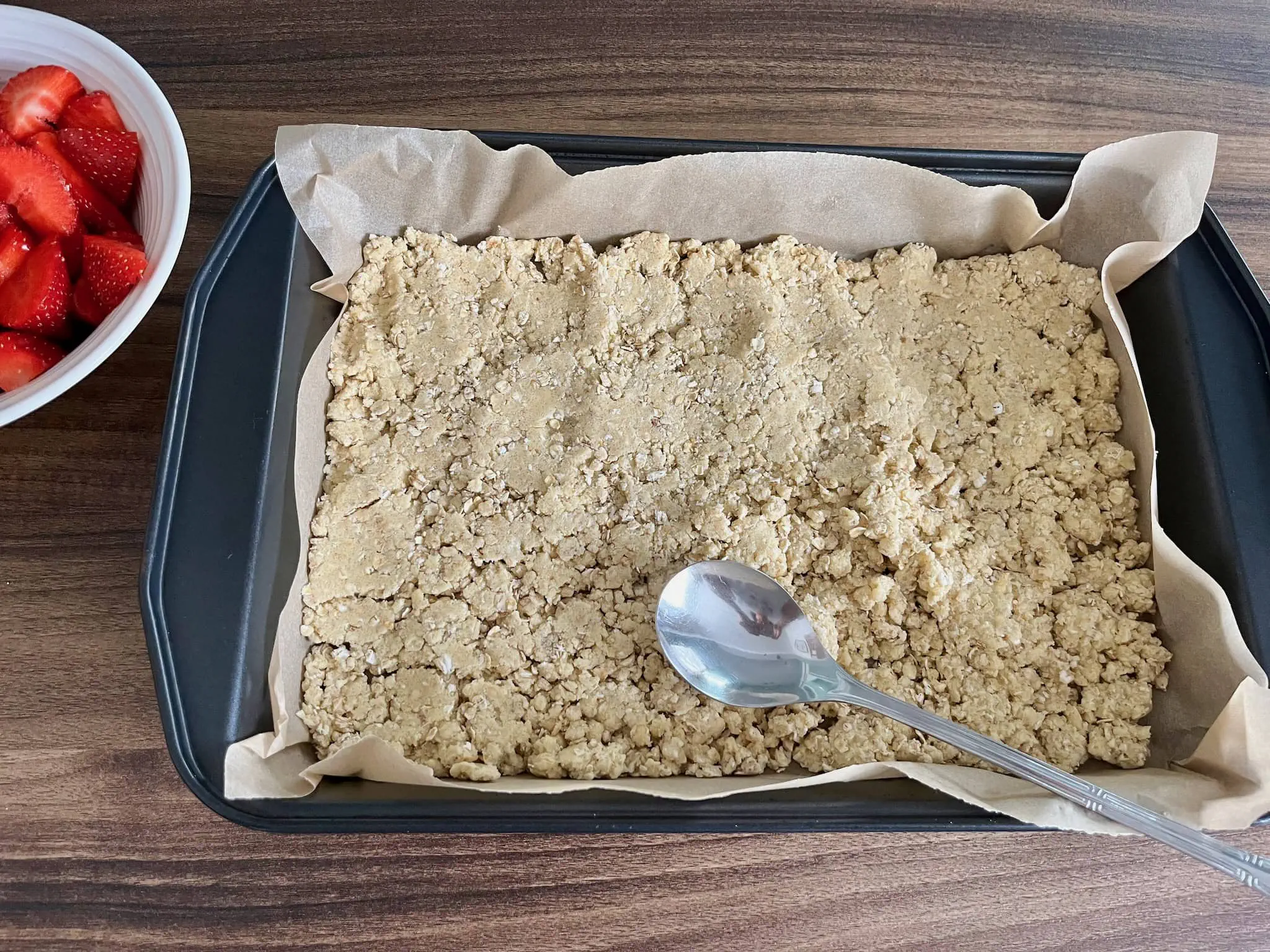 Oat dough flatten in the tray