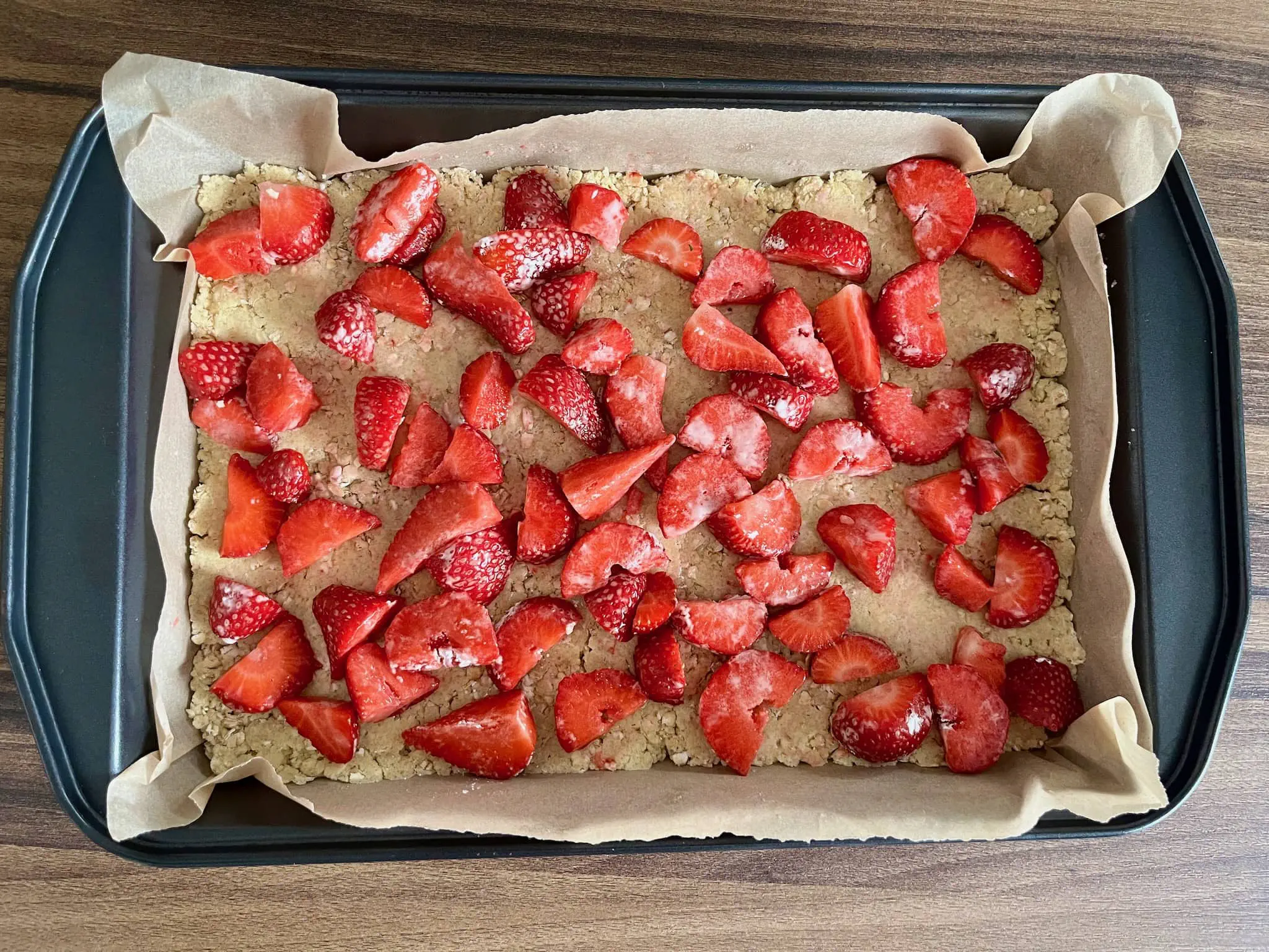 Strawberries on top of flatten the dough