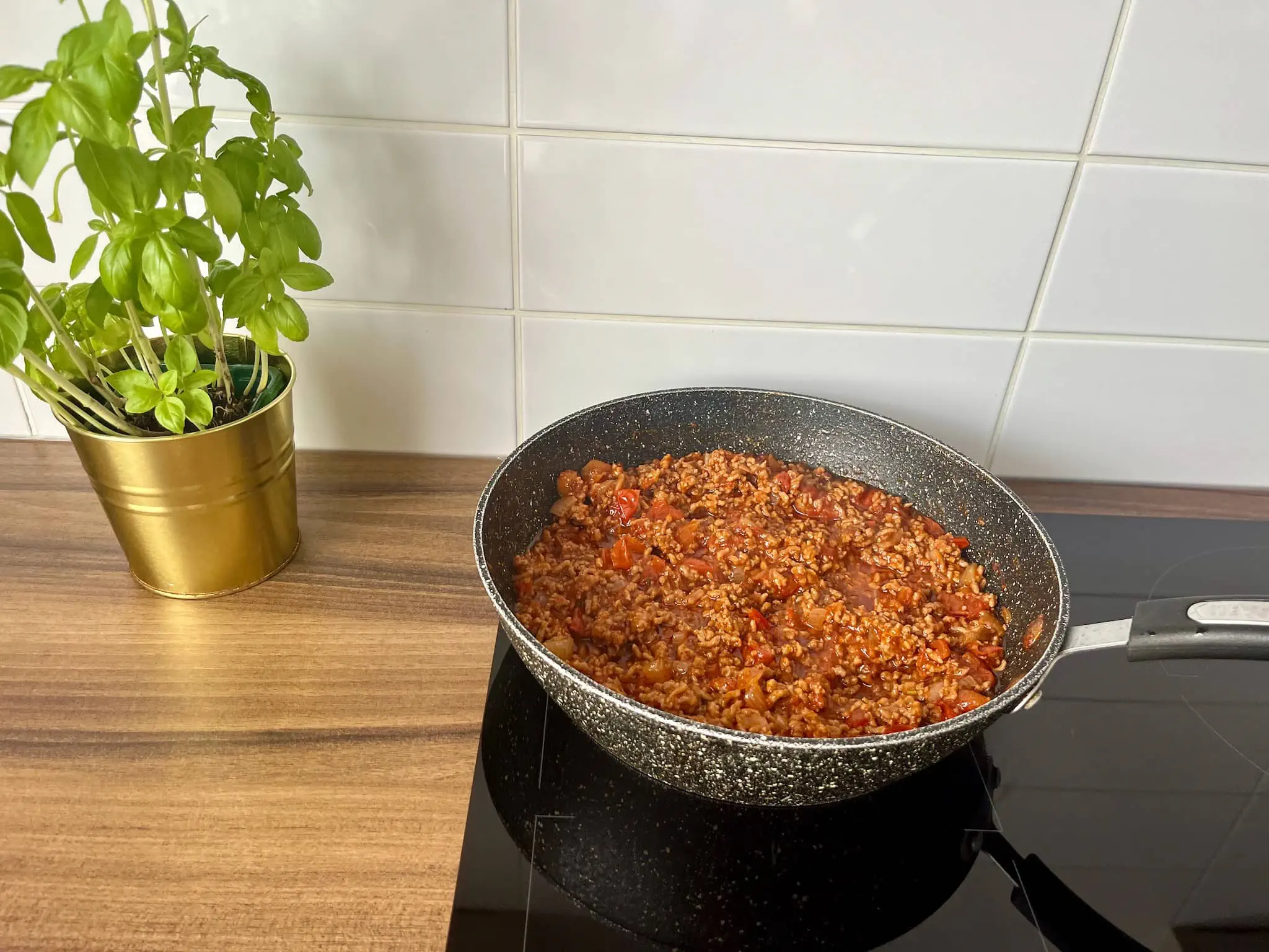 Bolognese simmering in a pan