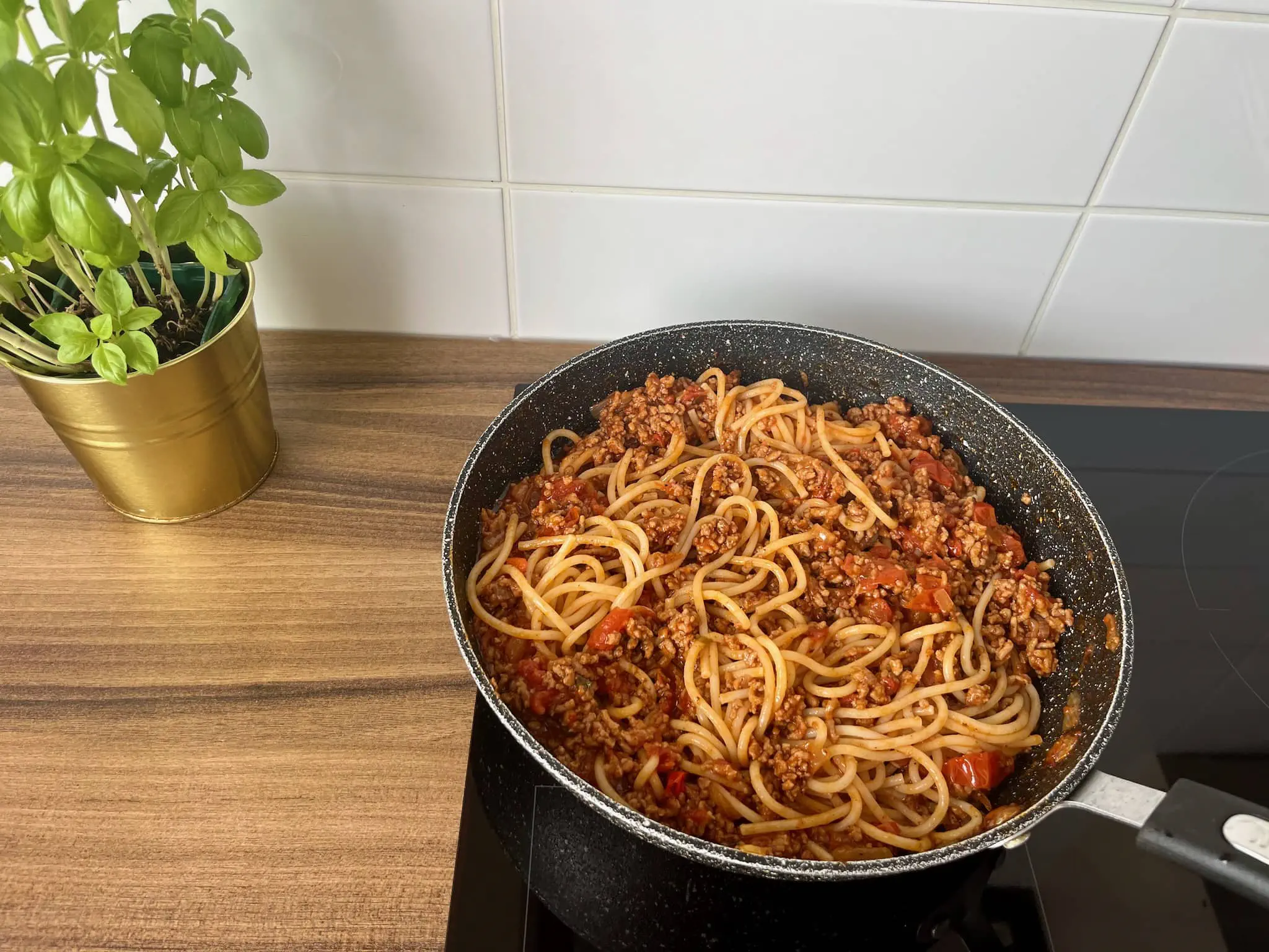 Ready bolognese mixed with pasta in a pan