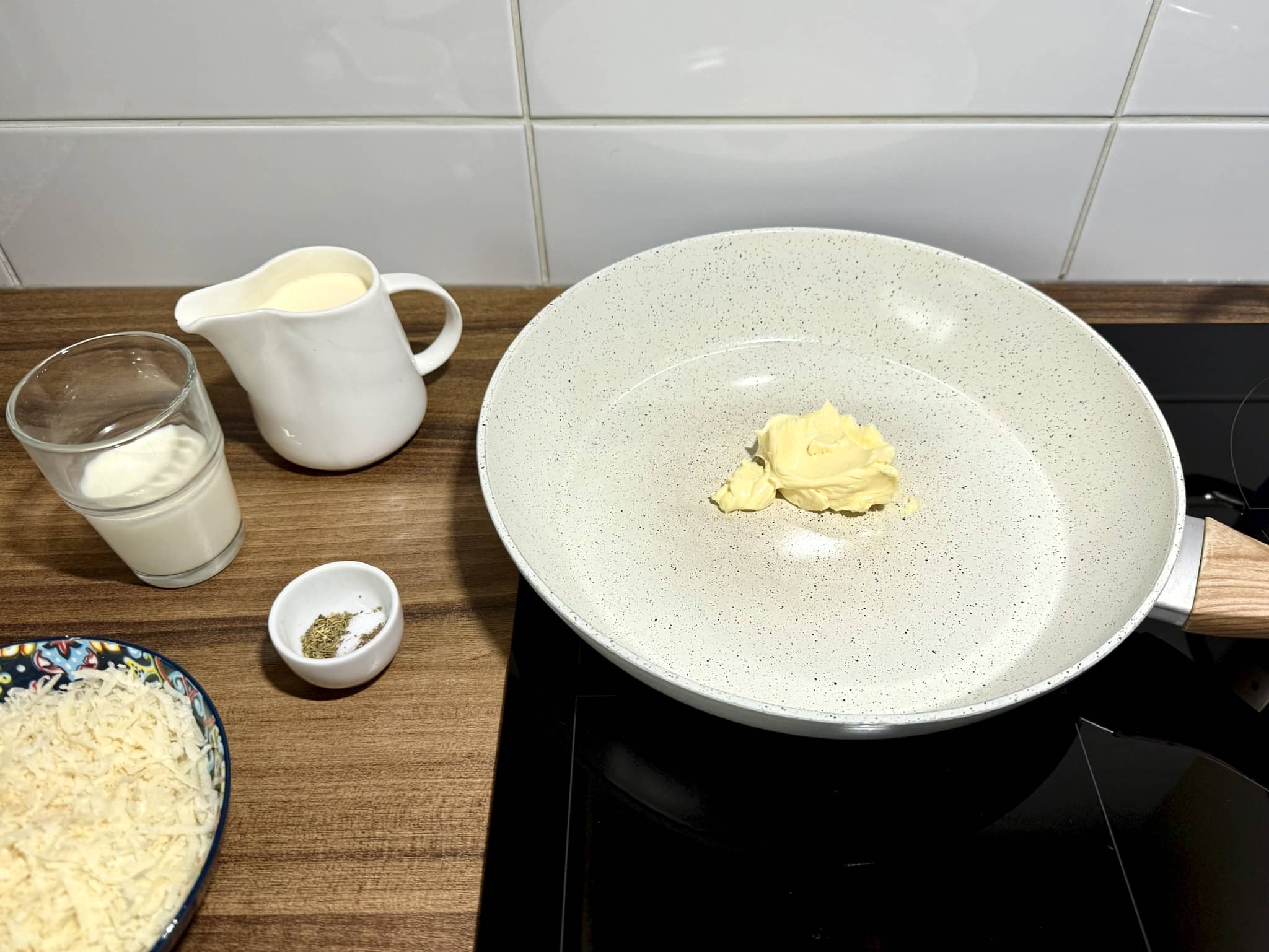 Butter melting in a pan with the other ingredients ready to be added