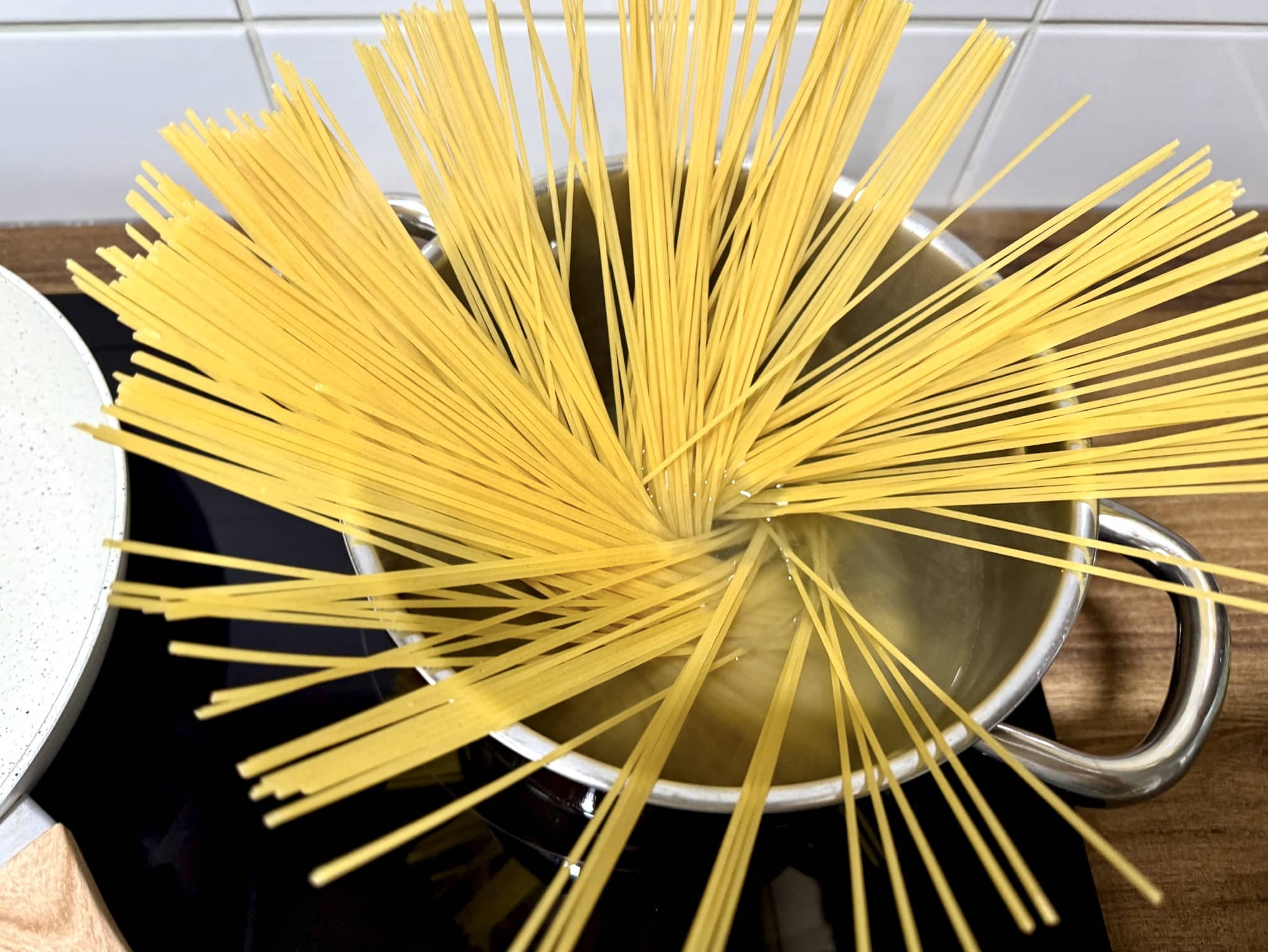 Spaghetti pasta cooking in a pot