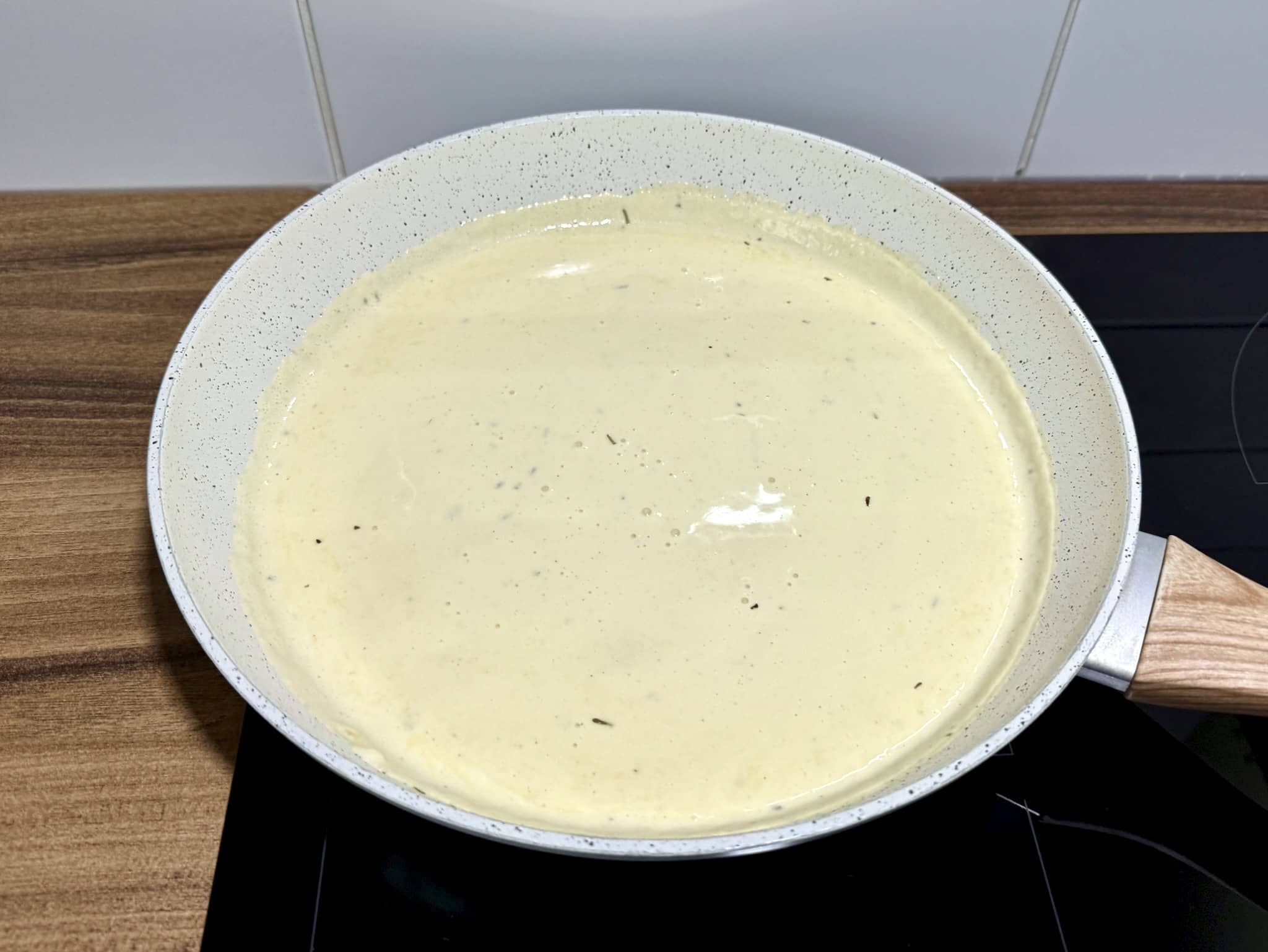 Creamy Alfredo sauce ready in a pan