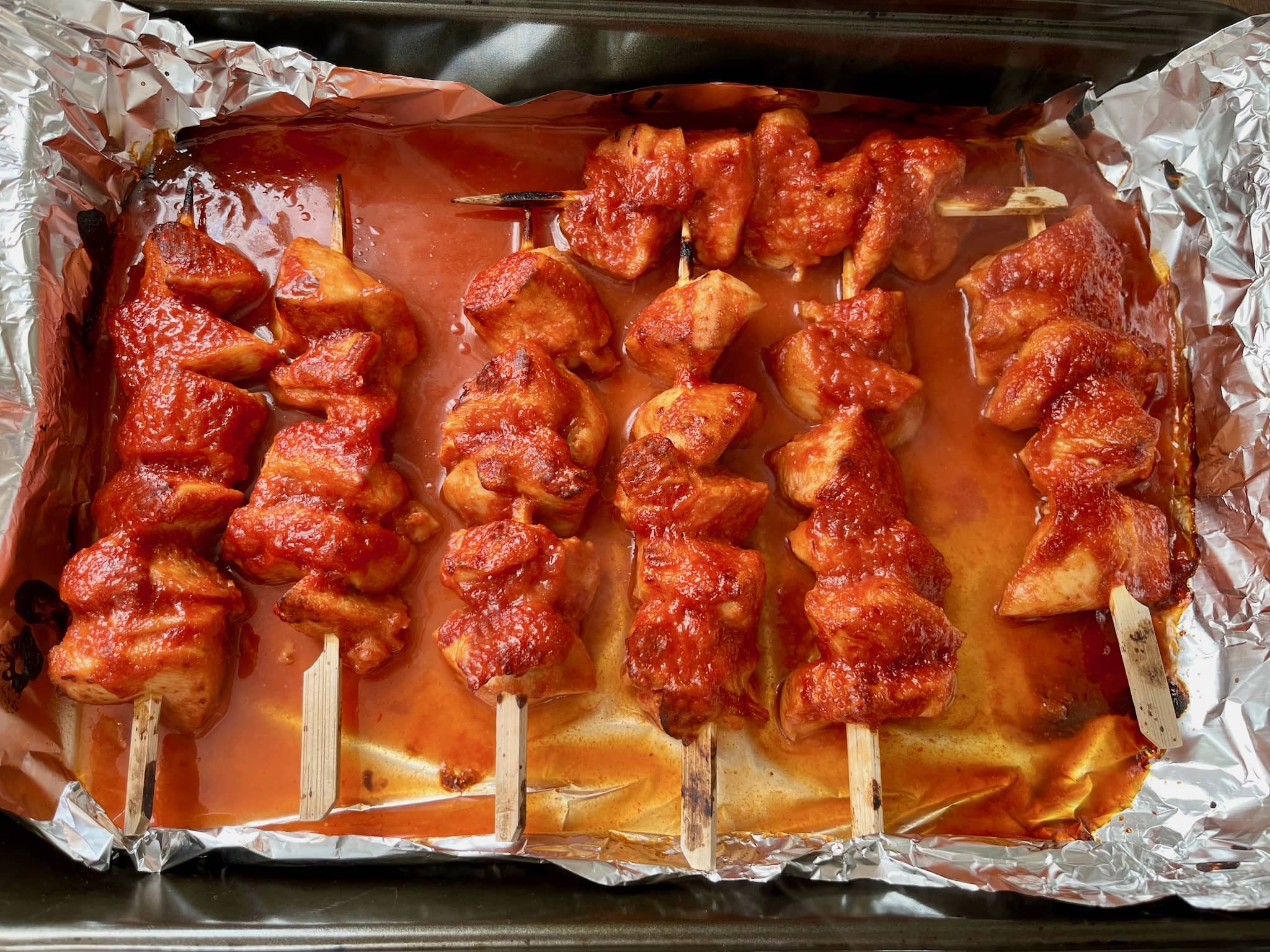 Baked Sticky Chicken Skewers straight from the oven