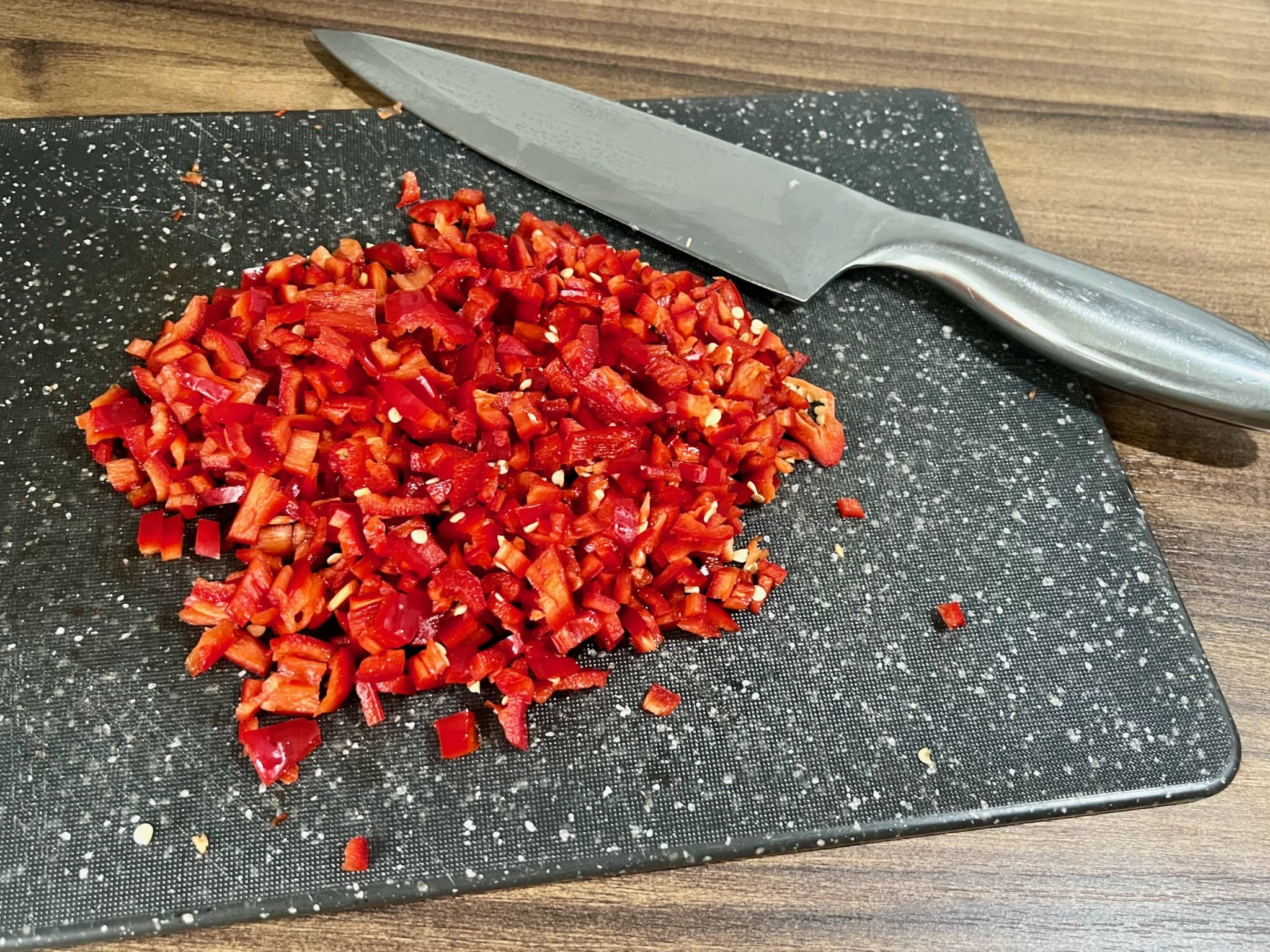 Sweet Chilli chopped finely on the chopping board