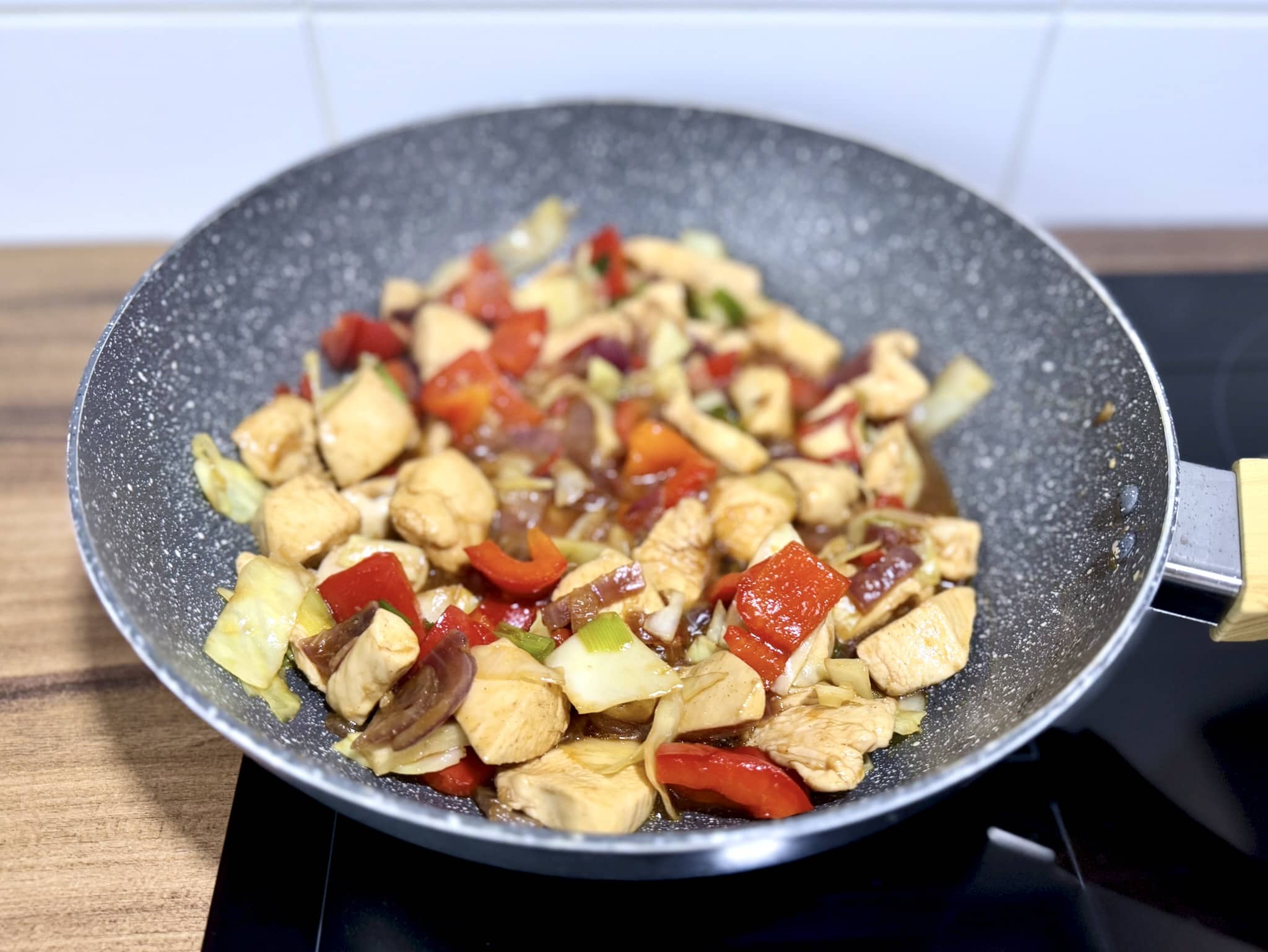 All ingredients in a pan nicely coated in sauce