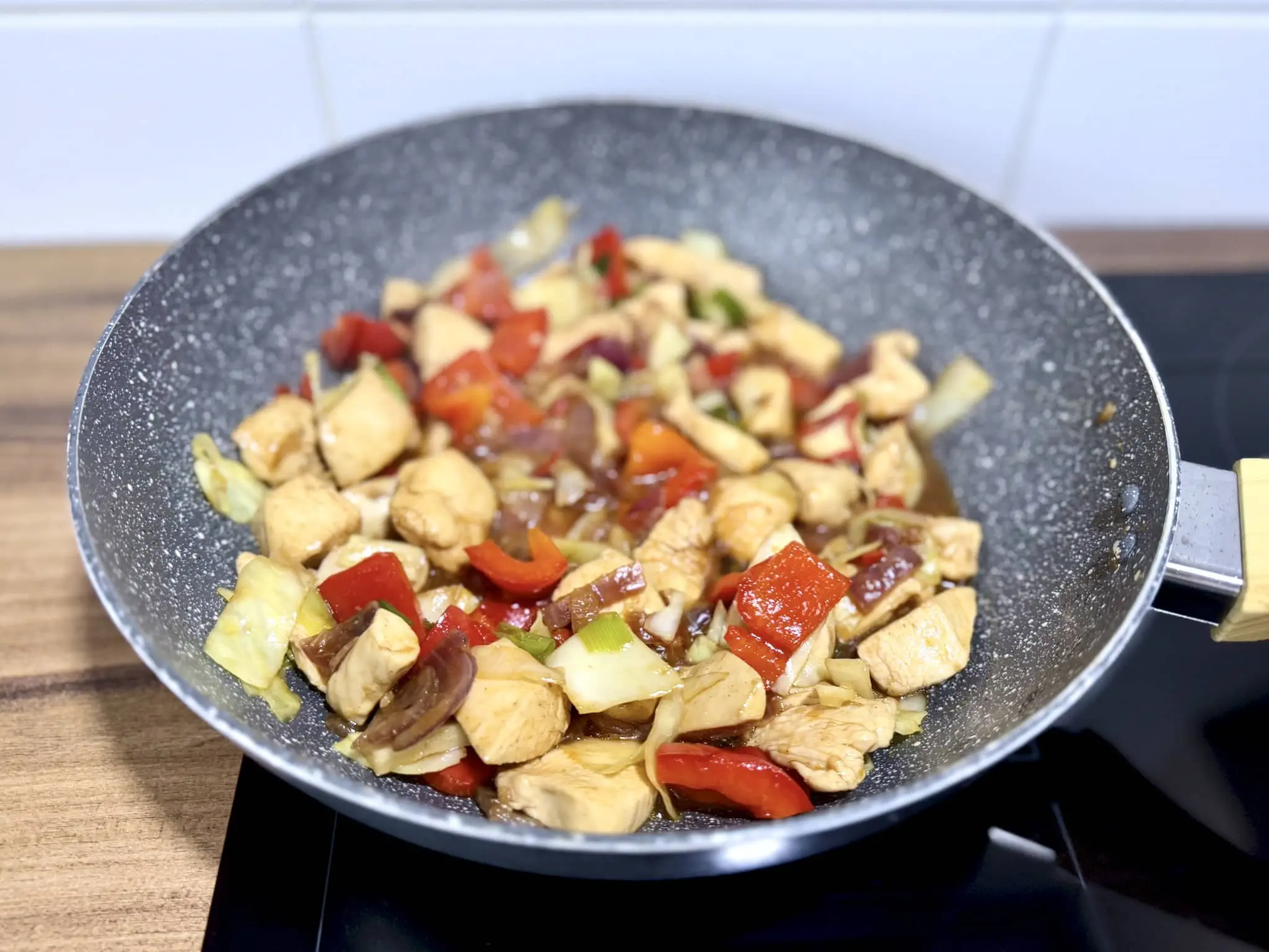 All ingredients in a pan nicely coated in sauce