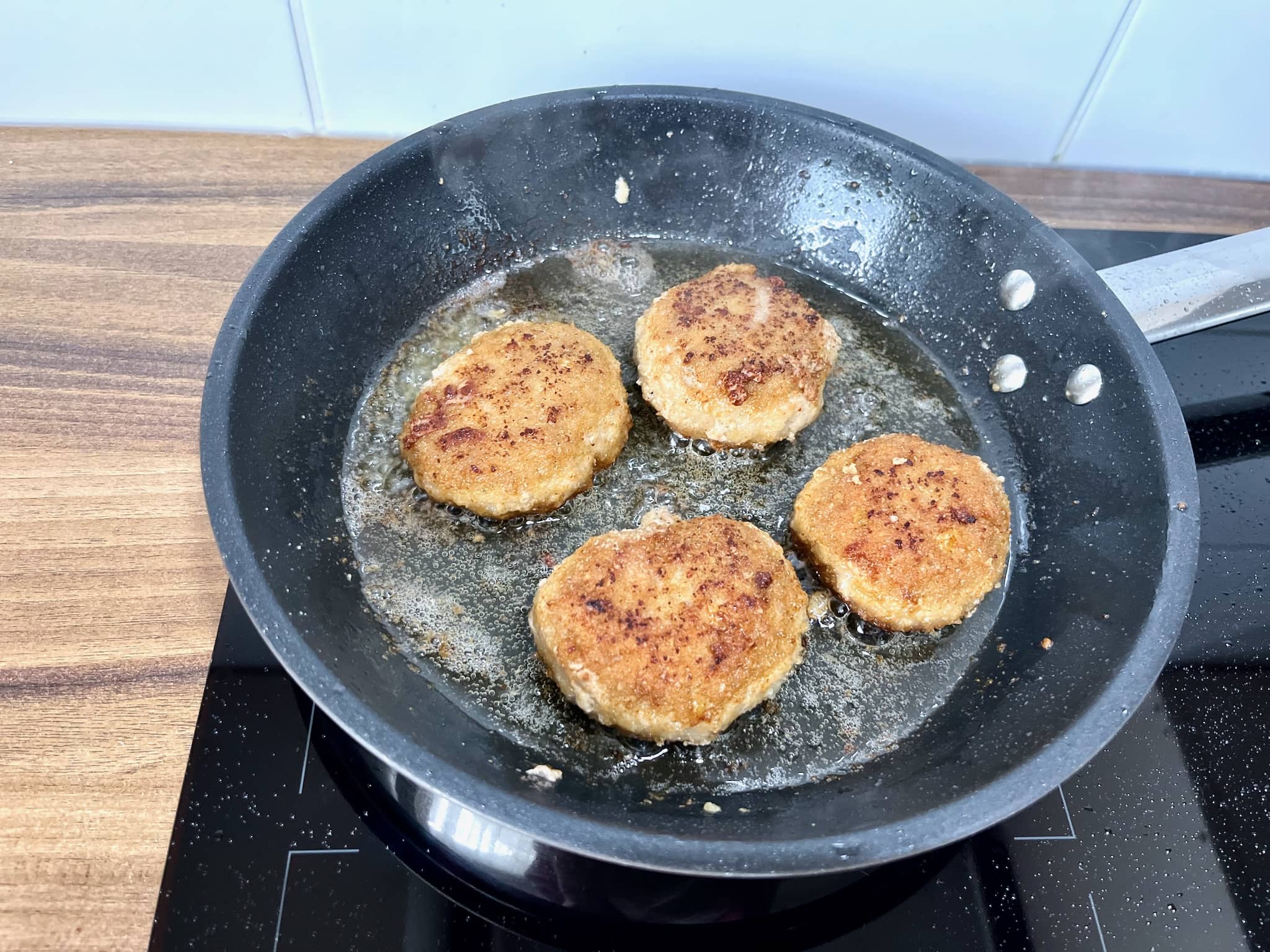 Frying Meat Patties in a frying pan on other side
