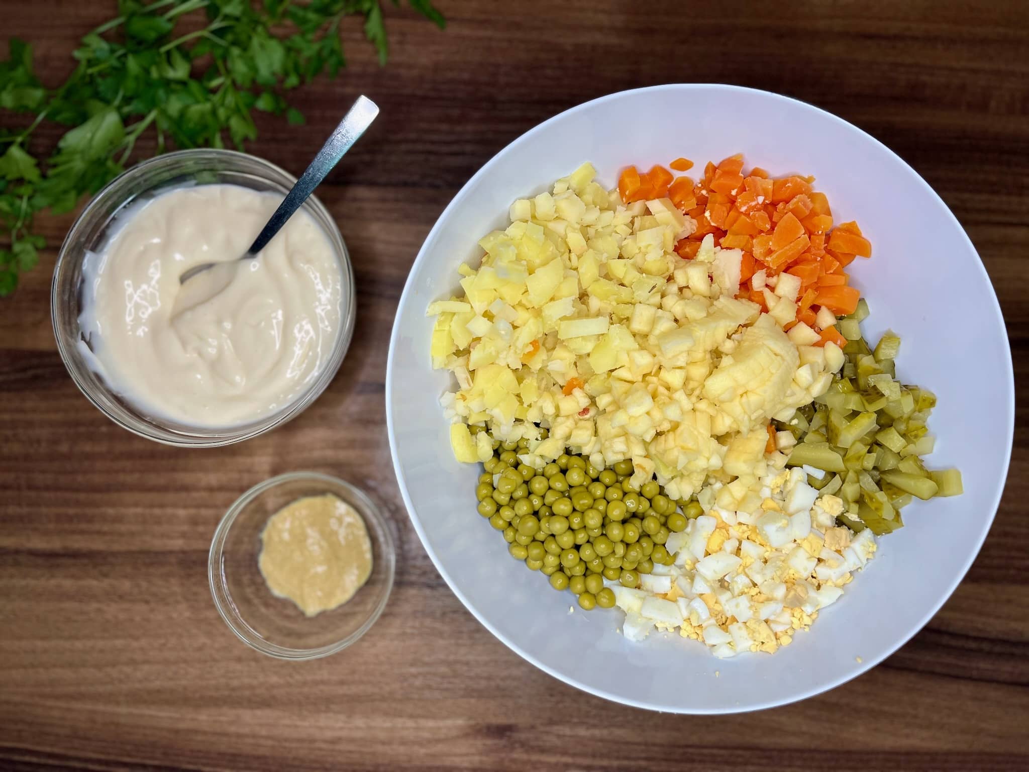 All diced ingredients are in a bowl with mayonnaise and mustard on the side