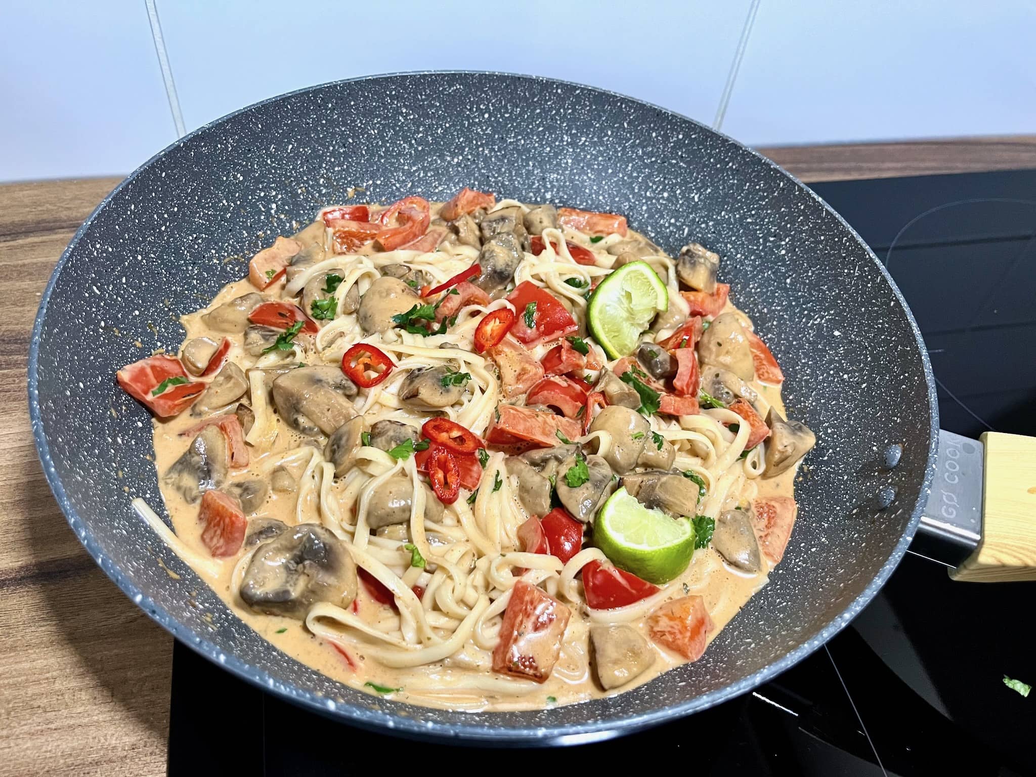 A pot of Veggie Thai Curry with Udon Noodles is ready to enjoy.